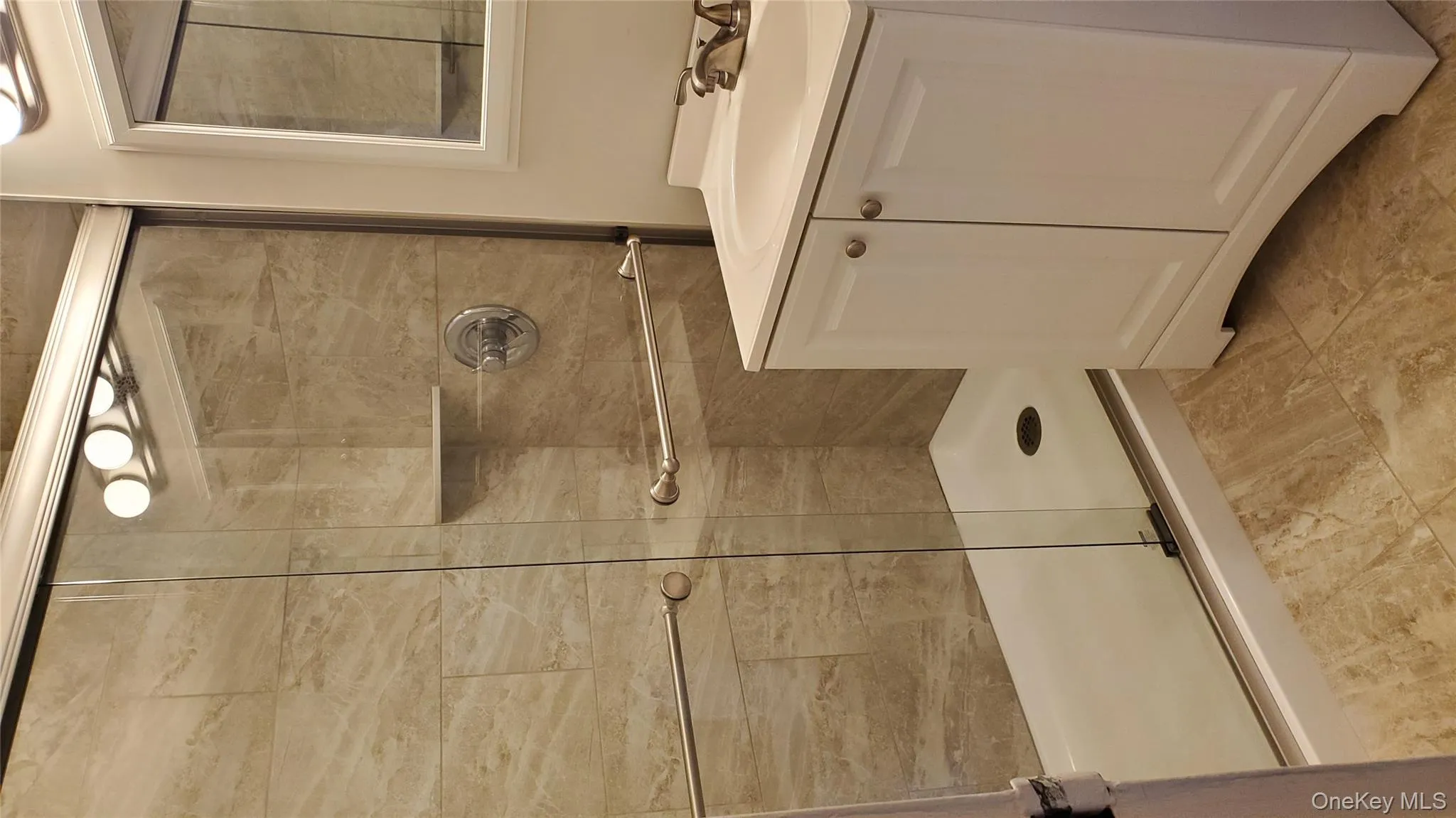 Full bath with vanity and a stall shower Full bath with vanity and a stall shower