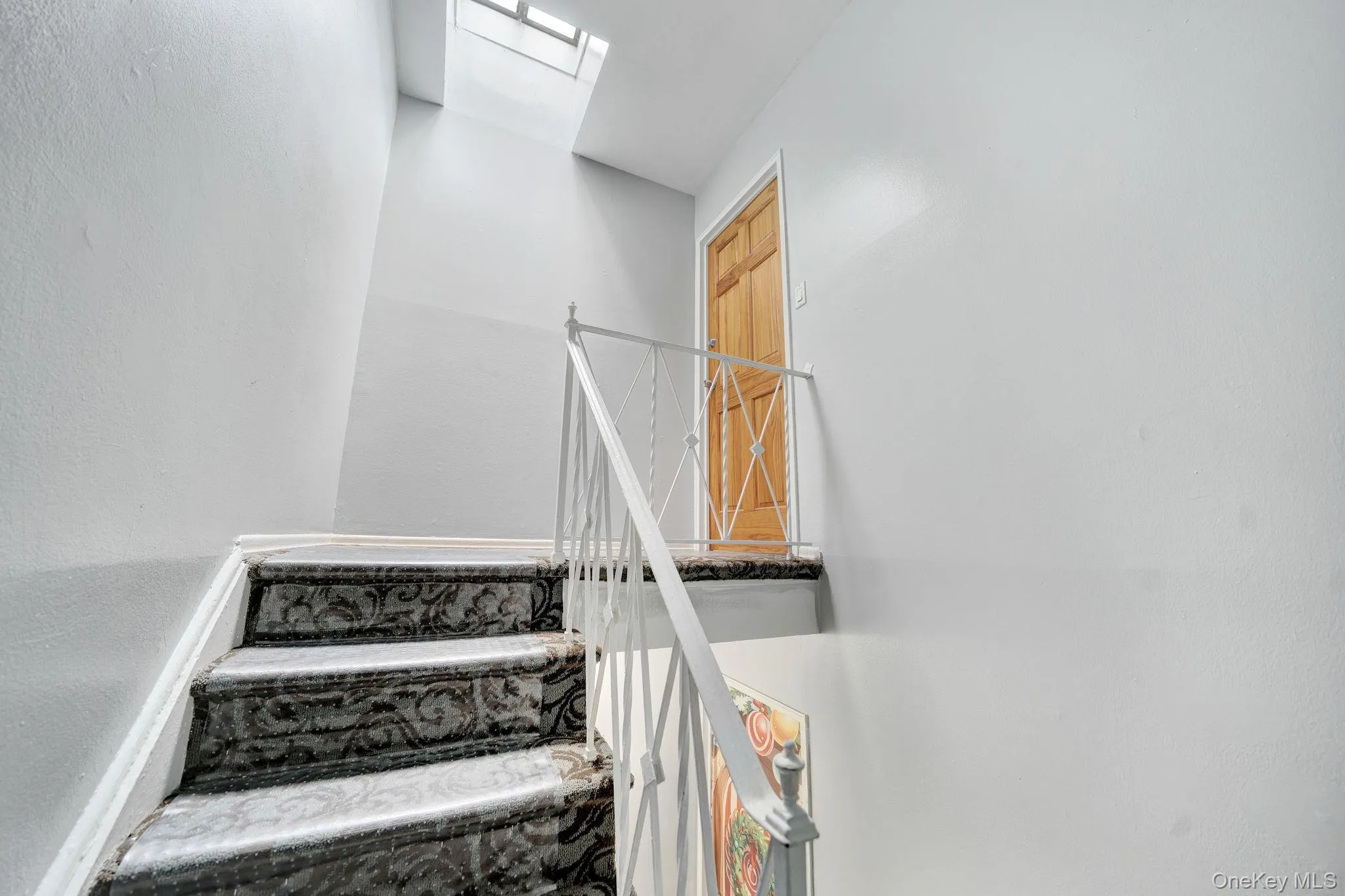 Stairs featuring a textured wall Stairs featuring a textured wall