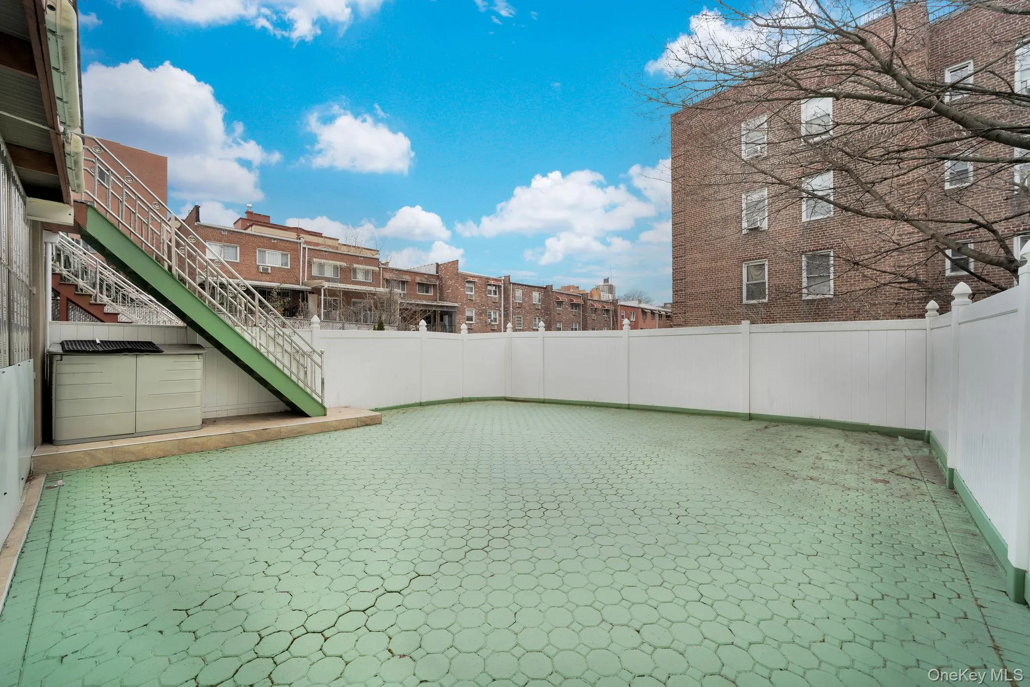 View of patio with stairs and a residential view View of patio with stairs and a residential view