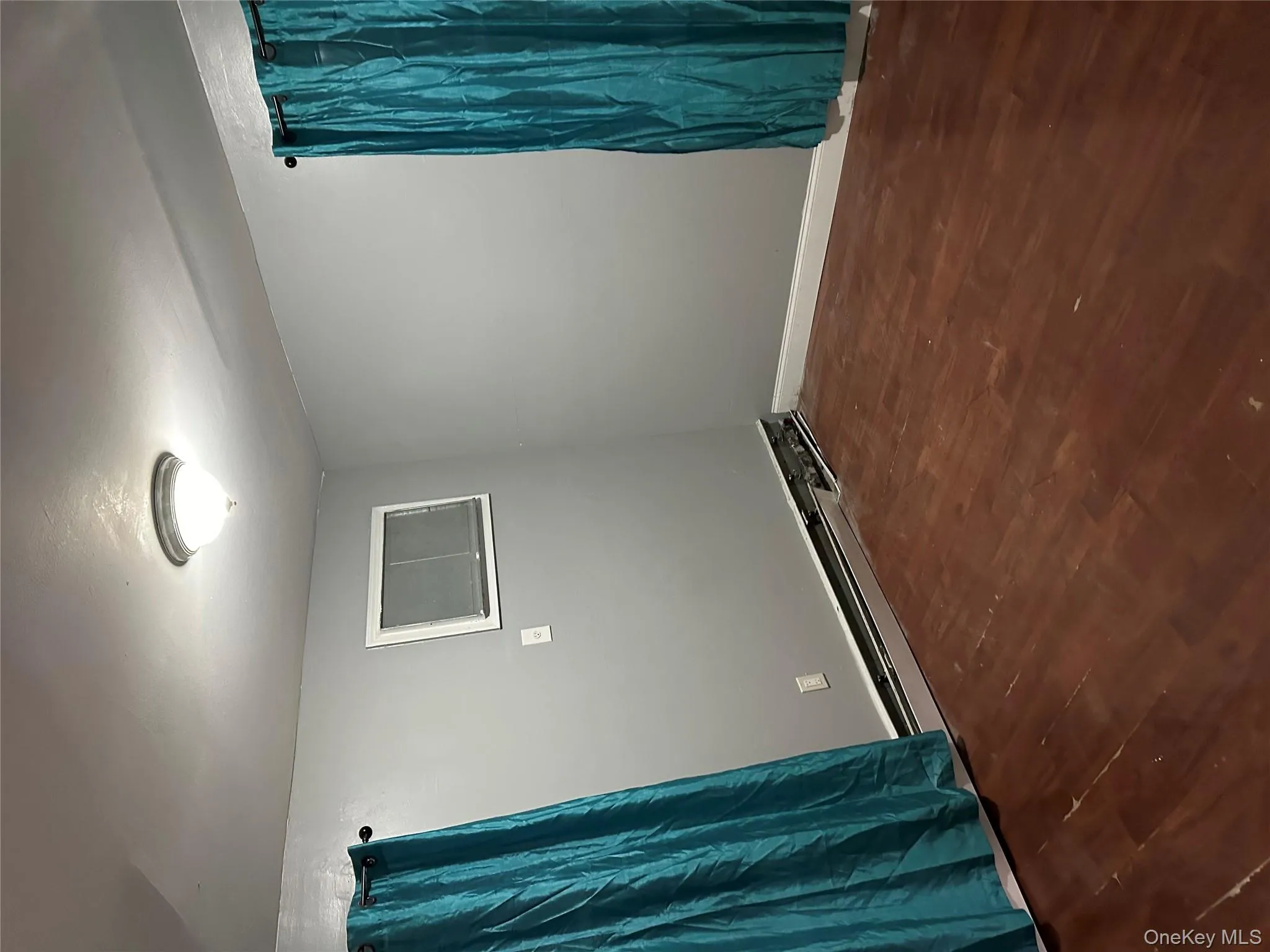 Spare room with dark wood-style flooring Spare room with dark wood-style flooring