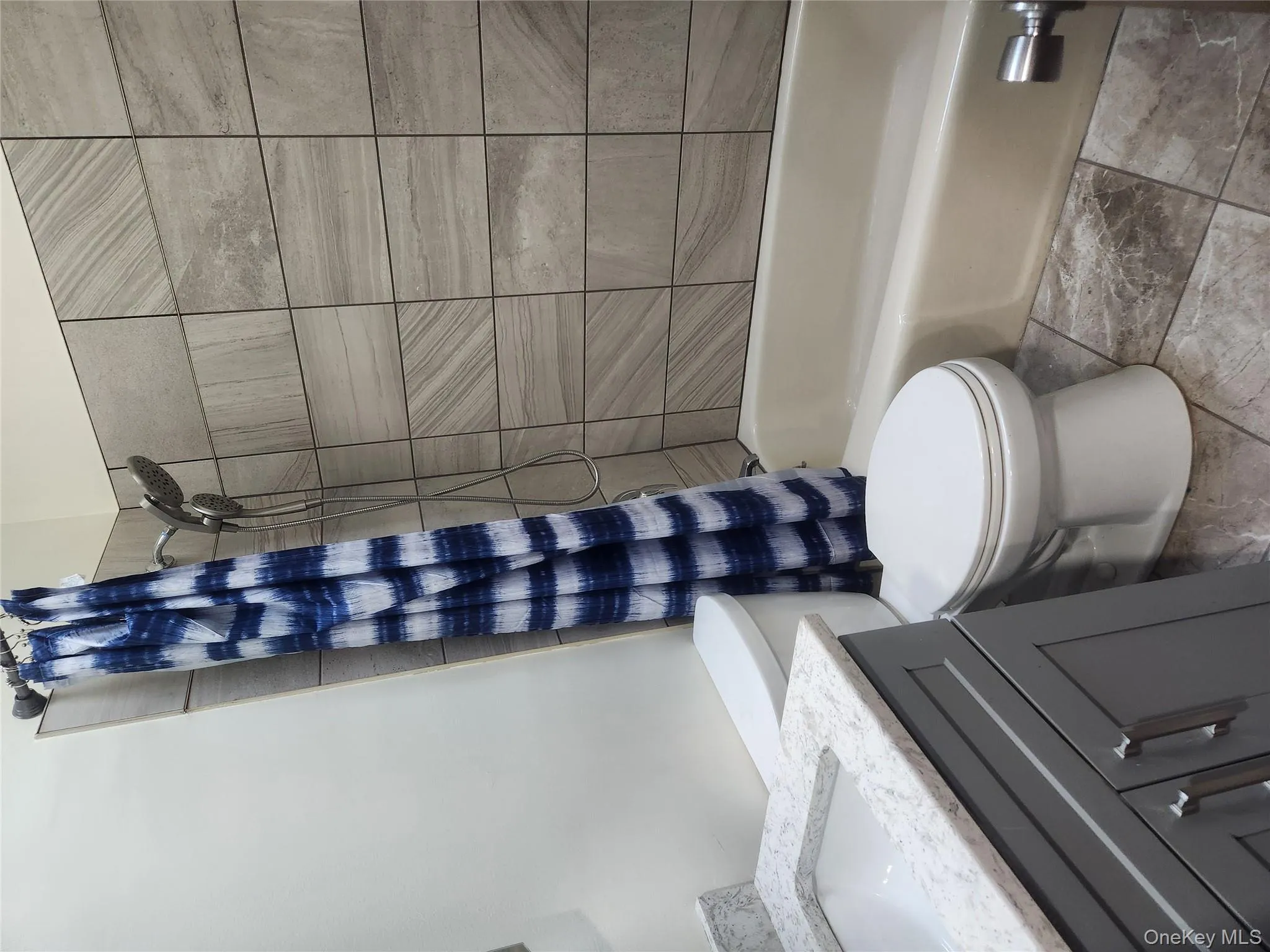 Full bath with shower / bath combo with shower curtain and vanity Full bath with shower / bath combo with shower curtain and vanity