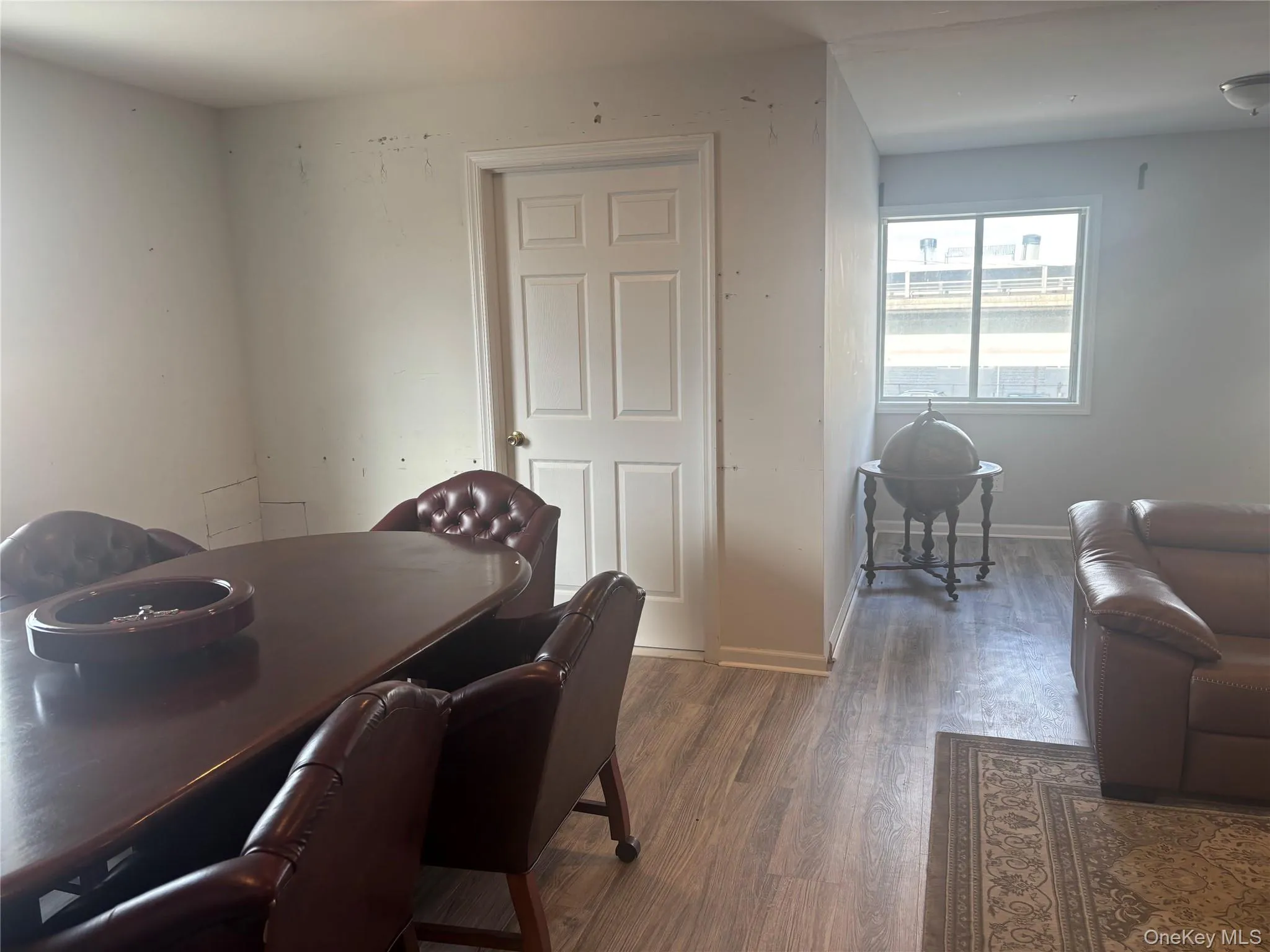 Office area with wood finished floors and baseboards Office area with wood finished floors and baseboards