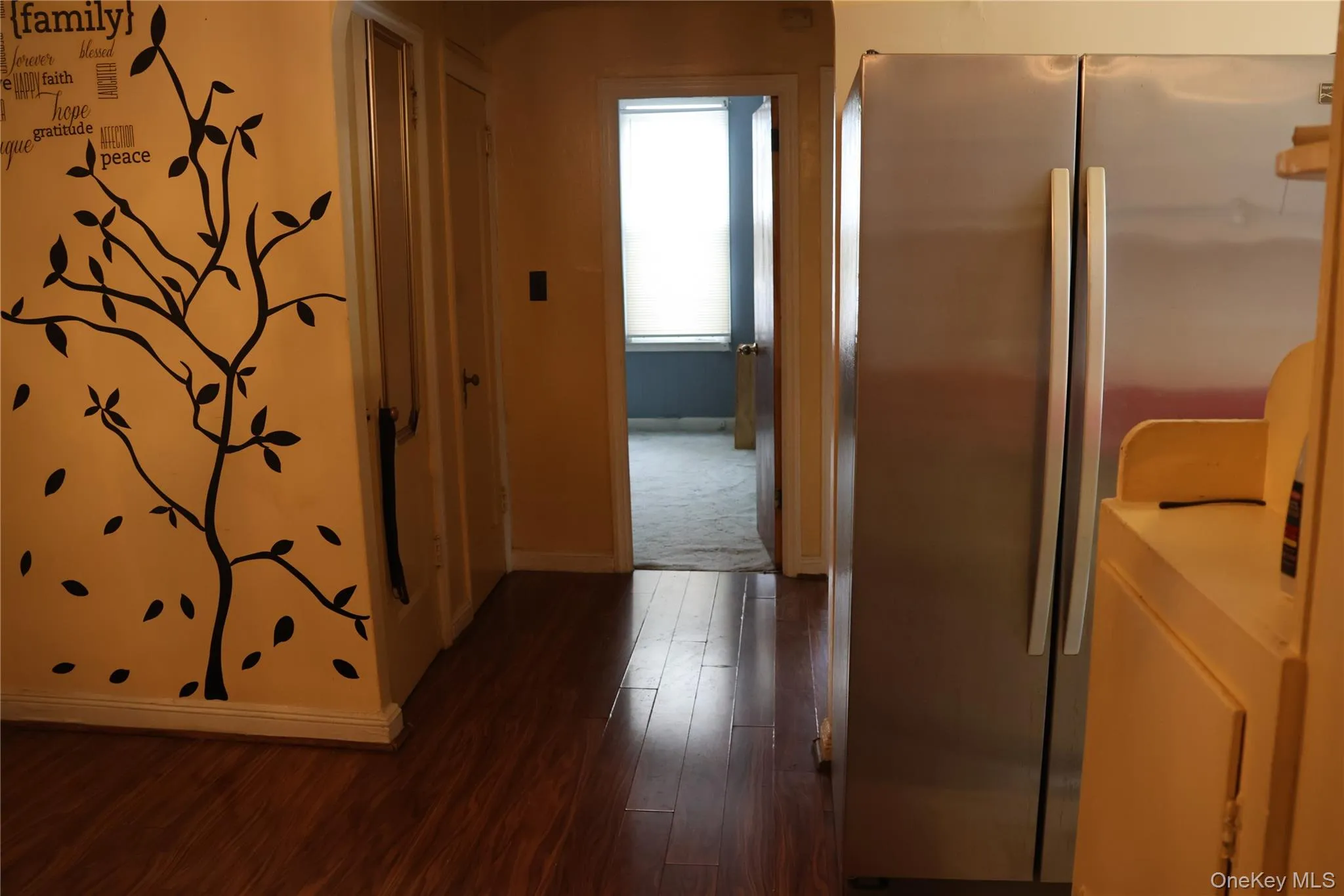 Hall with baseboards and dark wood-type flooring Hall with baseboards and dark wood-type flooring