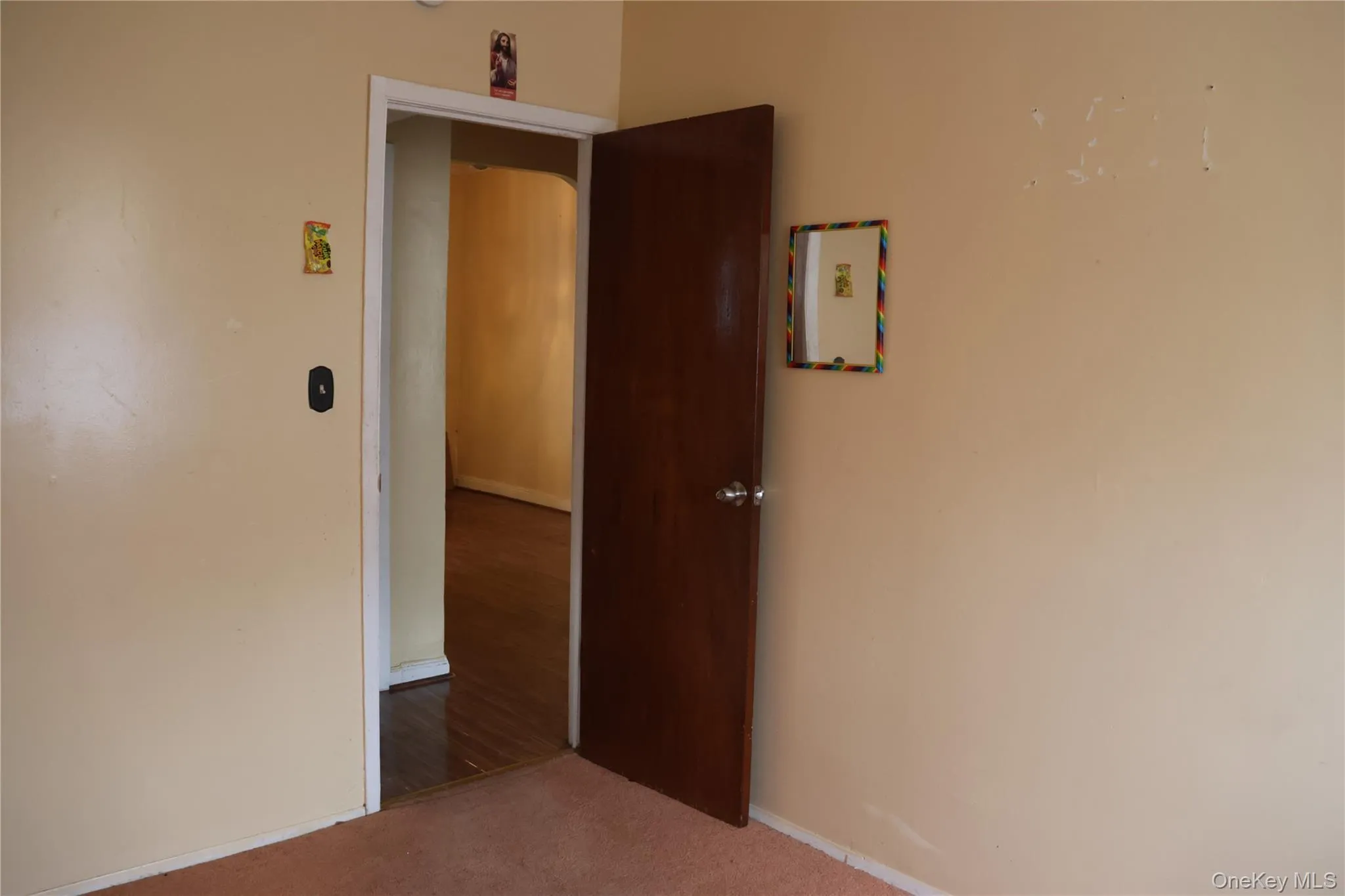 Unfurnished room with carpet and baseboards Unfurnished room with carpet and baseboards