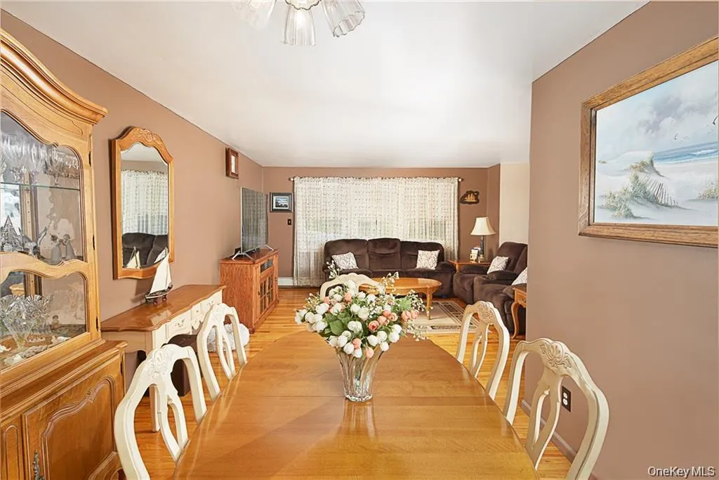 Dining room featuring wood finished floors Dining room featuring wood finished floors