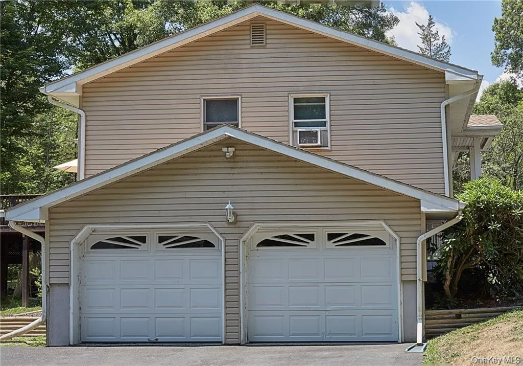 Garage featuring driveway Garage featuring driveway