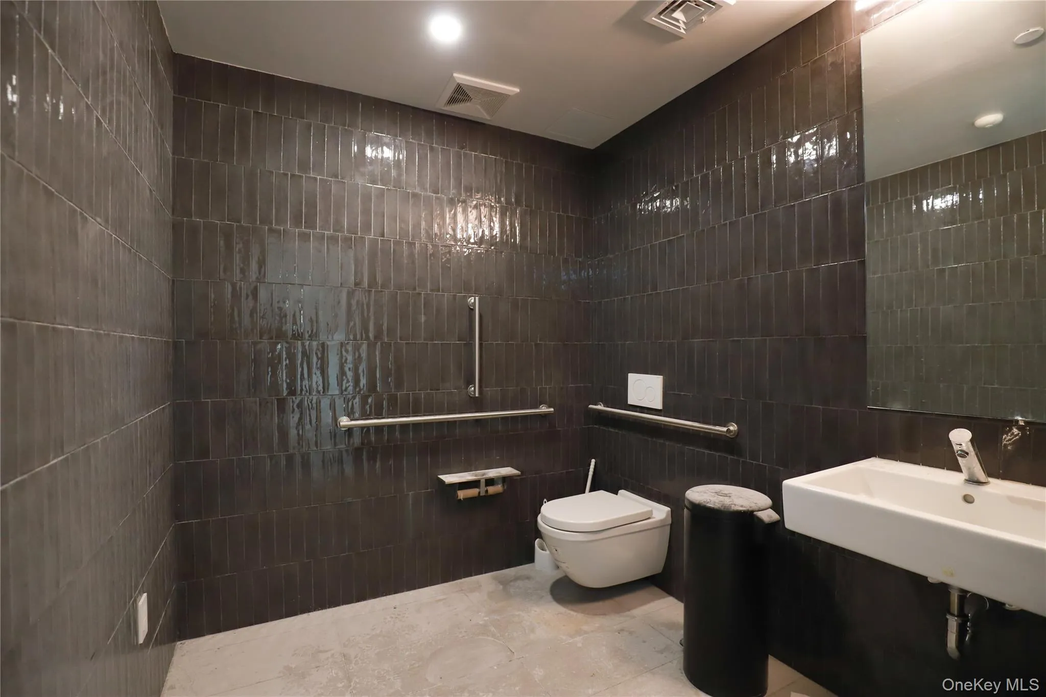 Full bath featuring tile walls Full bath featuring tile walls