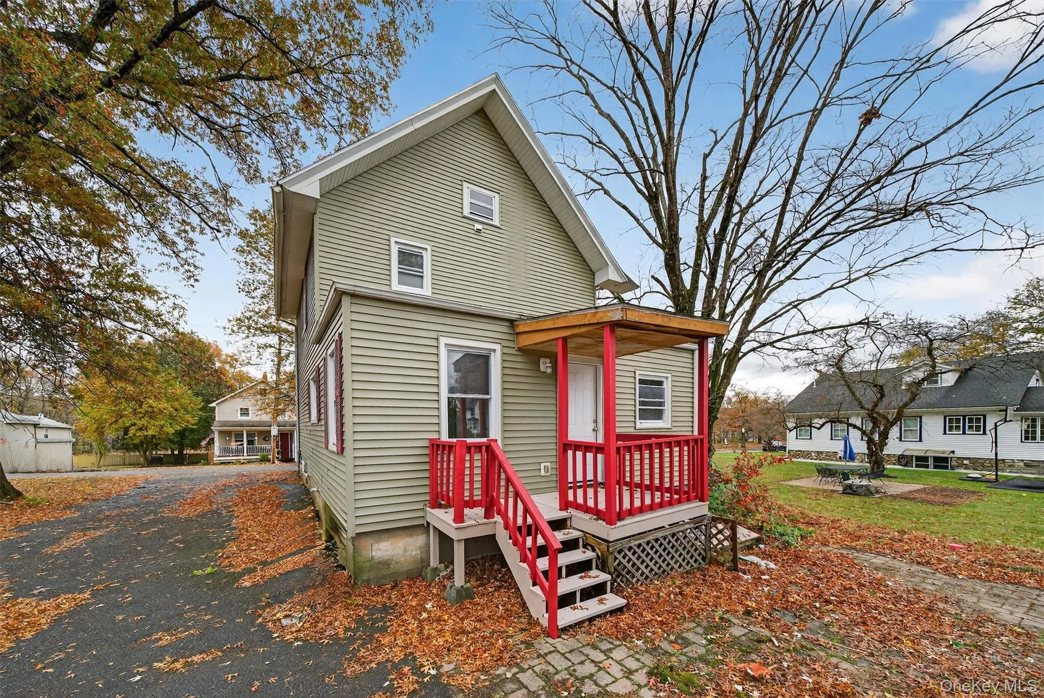 View of front of house featuring a wooden deck View of front of house featuring a wooden deck
