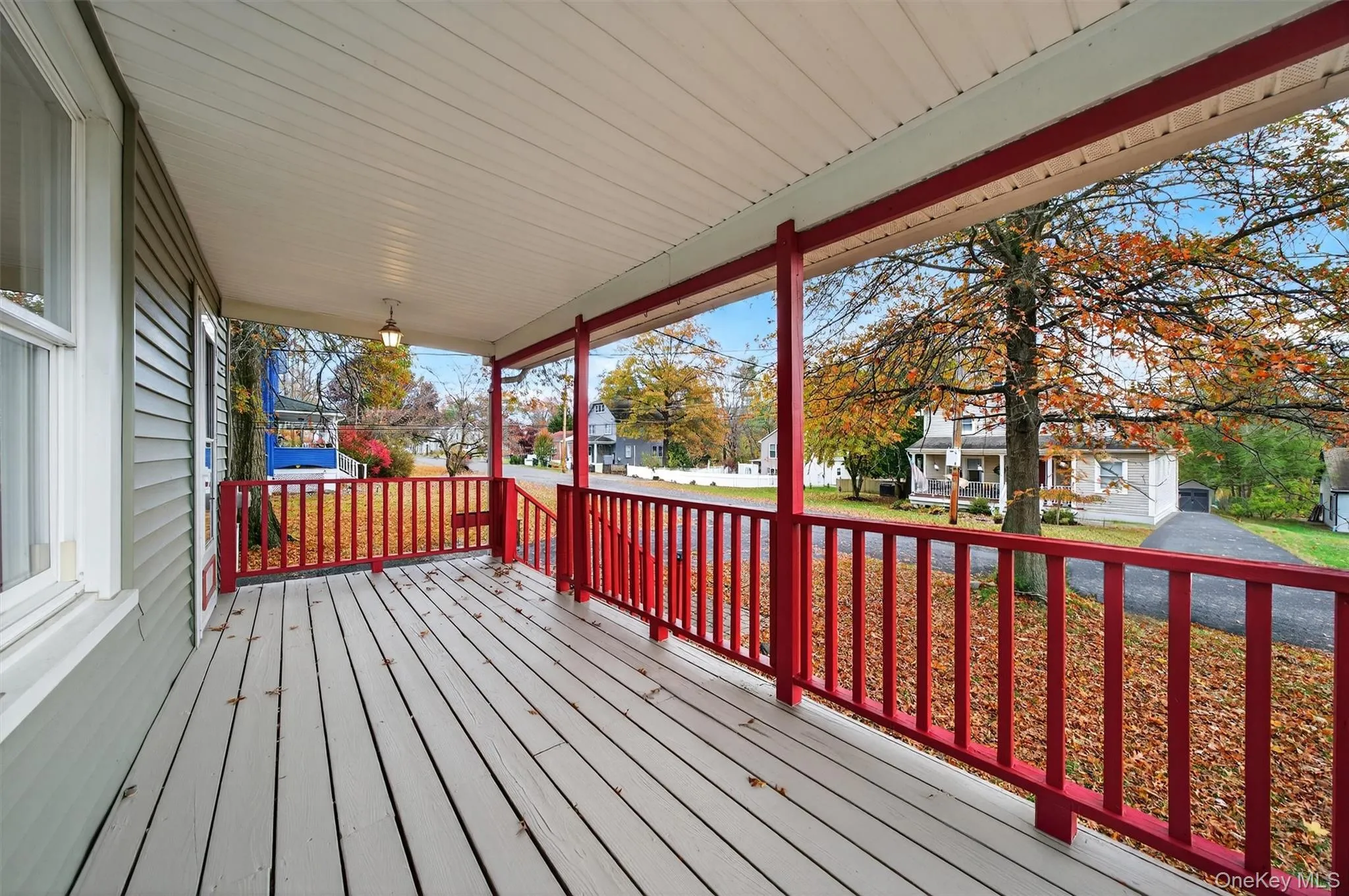 Porch featuring a residential view and a yard Porch featuring a residential view and a yard