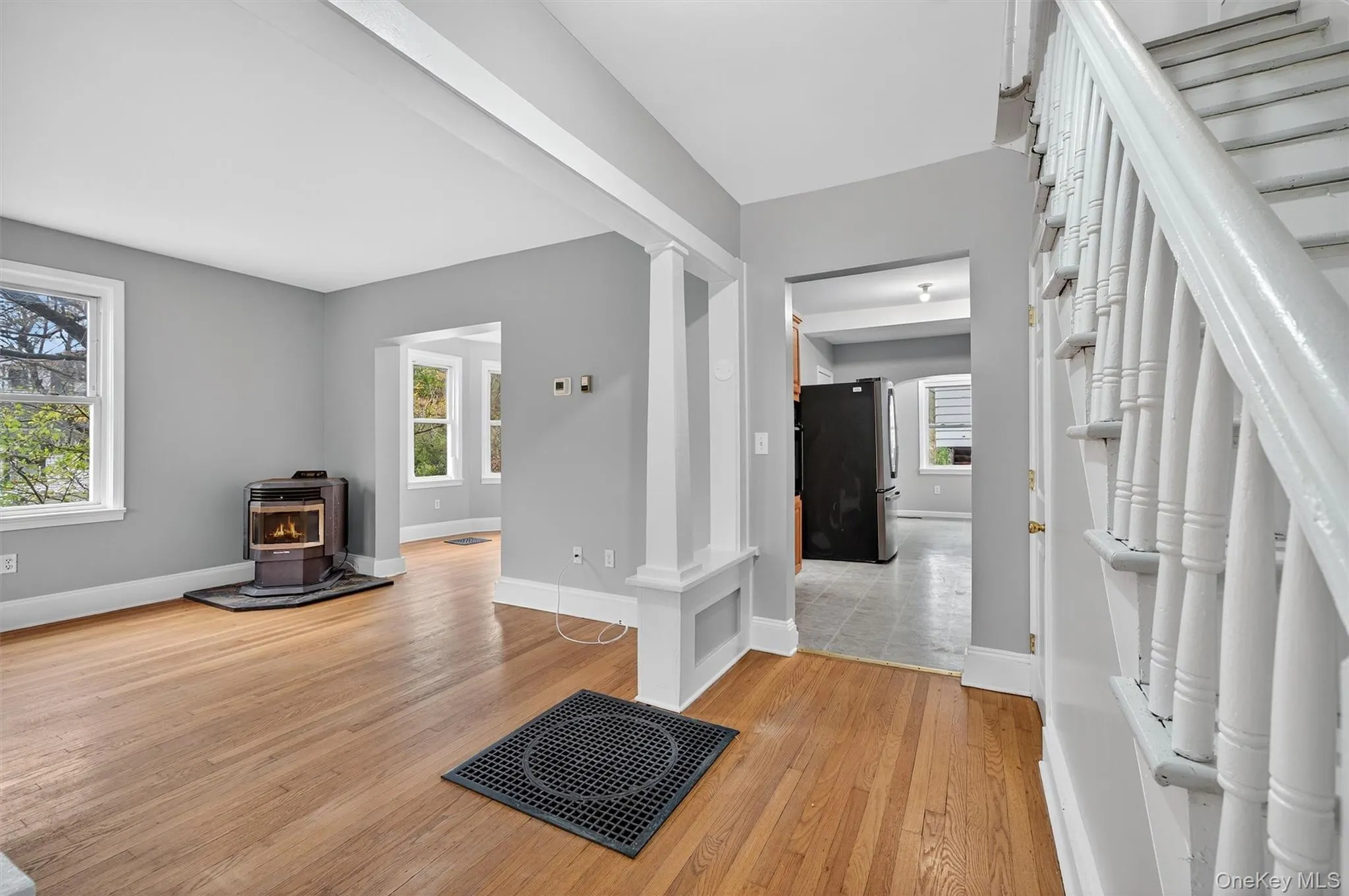 Entryway with a wood stove and light wood finished floors Entryway with a wood stove and light wood finished floors