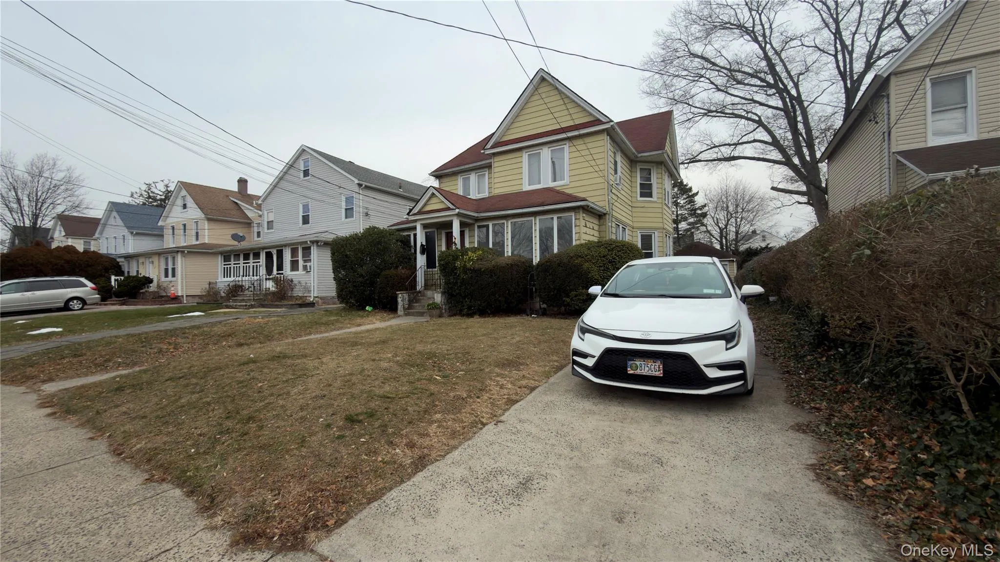 View of front of property with a front lawn and a residential view View of front of property with a front lawn and a residential view