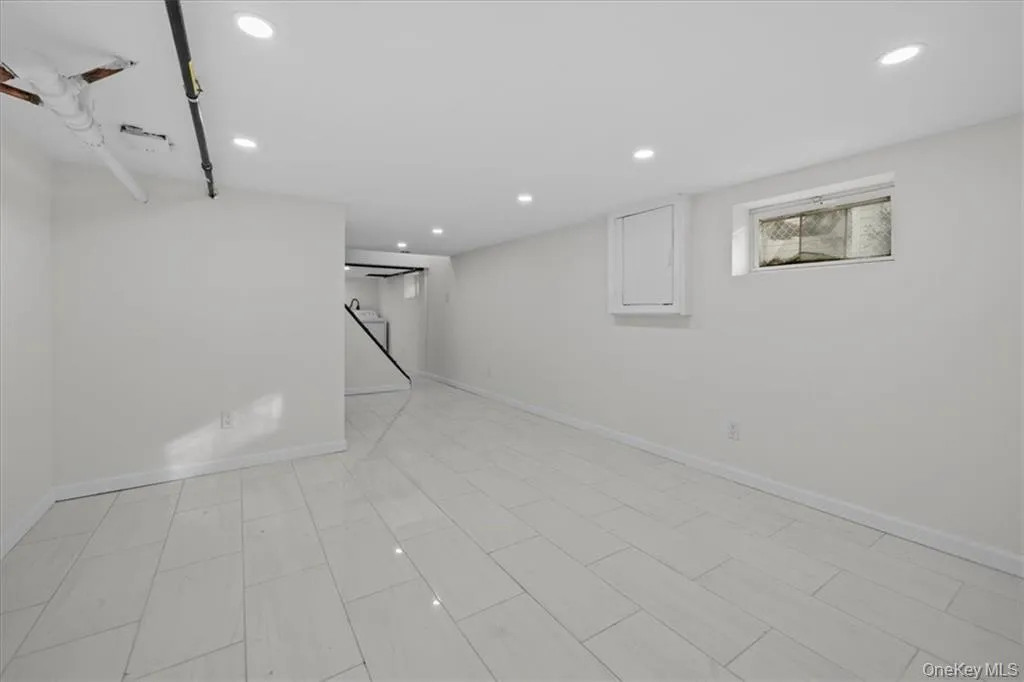 Basement featuring recessed lighting and baseboards Basement featuring recessed lighting and baseboards