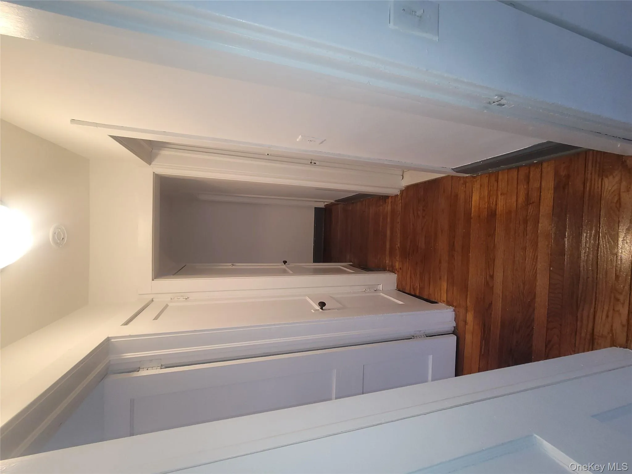 Hall featuring dark wood finished floors Hall featuring dark wood finished floors