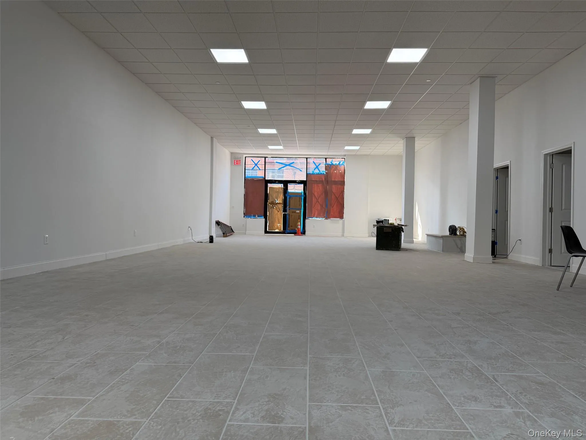 Empty room with a paneled ceiling Empty room with a paneled ceiling