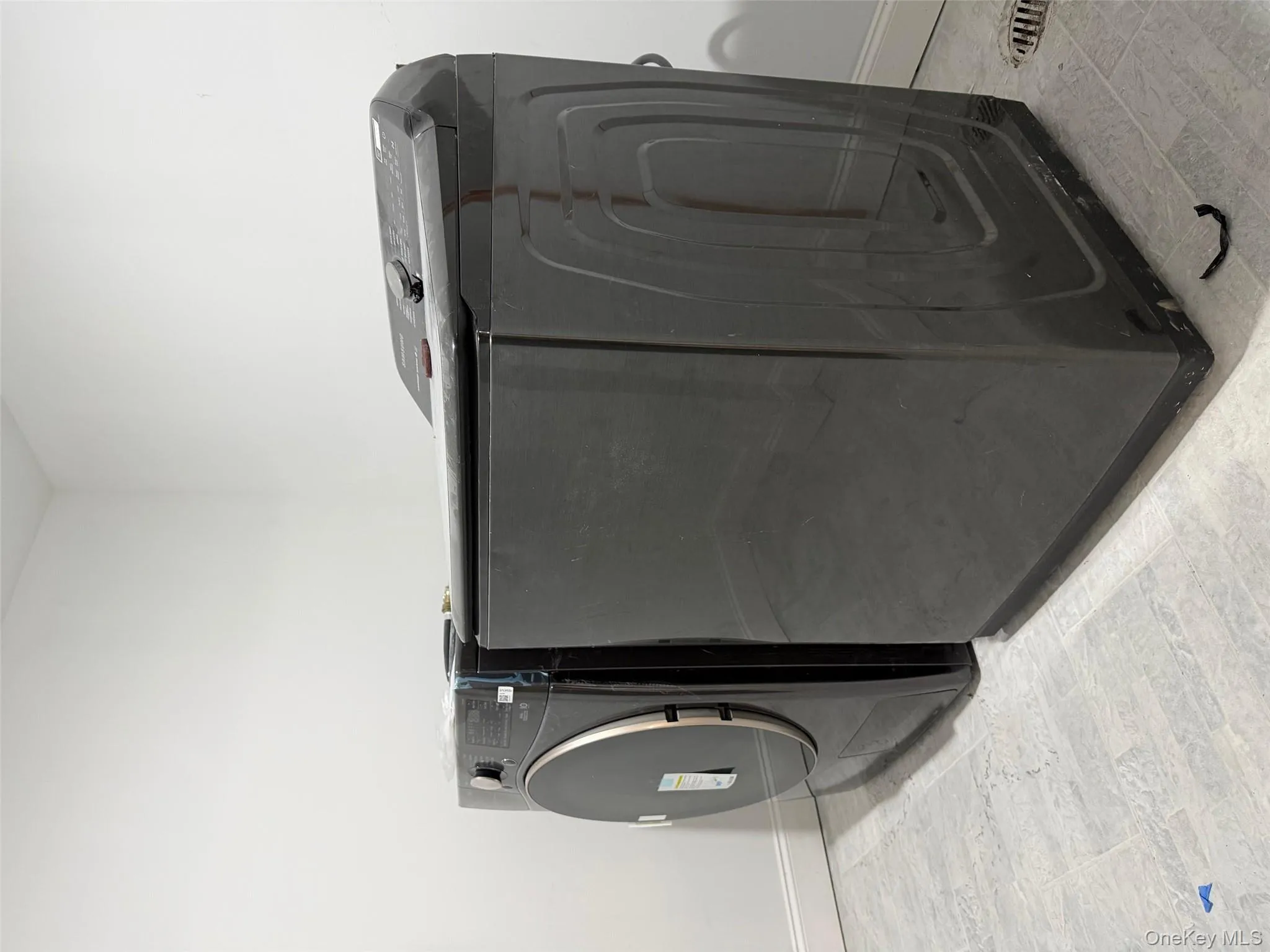 Laundry room with baseboards and separate washer and dryer Laundry room with baseboards and separate washer and dryer