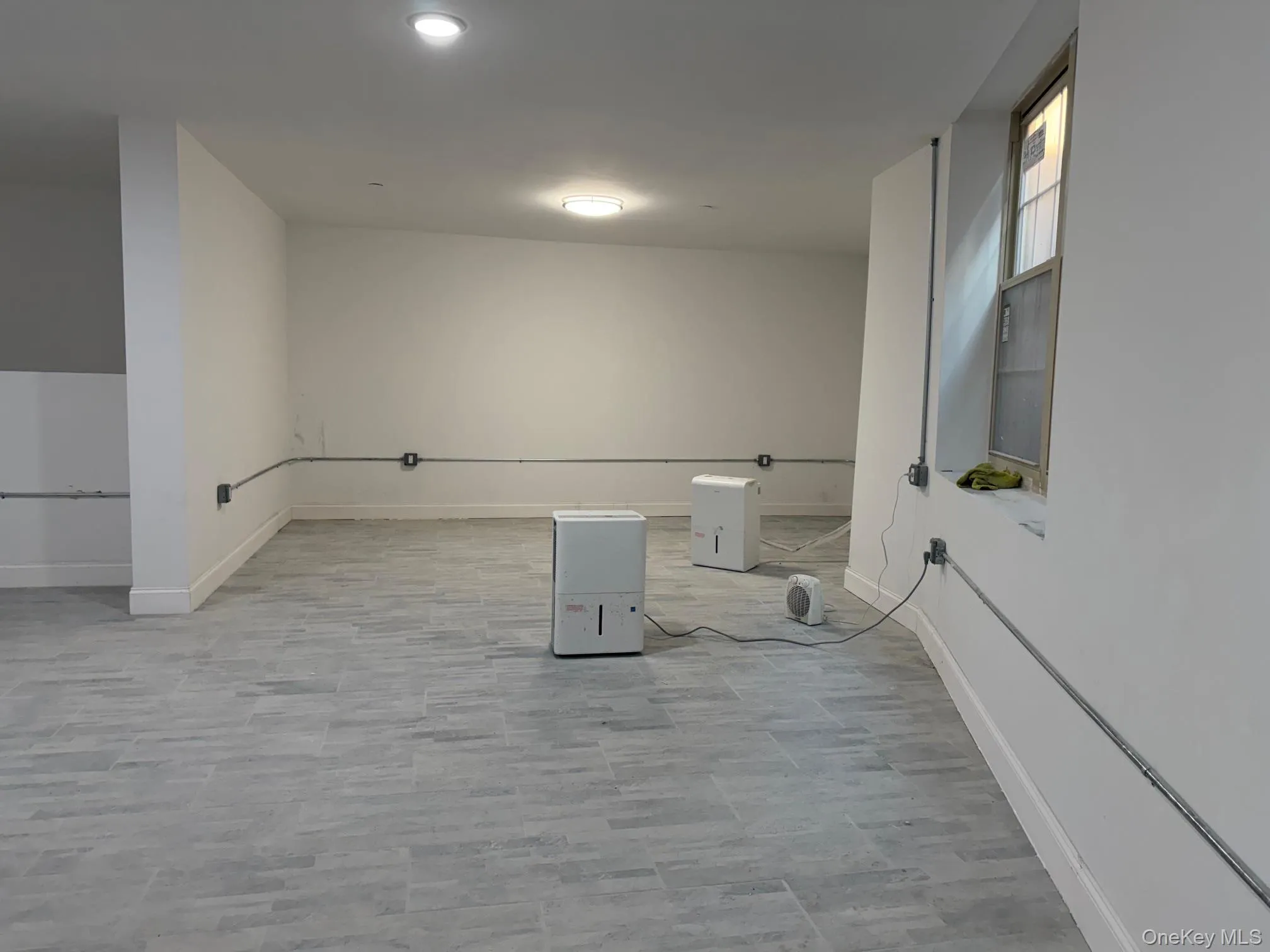 Laundry area featuring baseboards Laundry area featuring baseboards