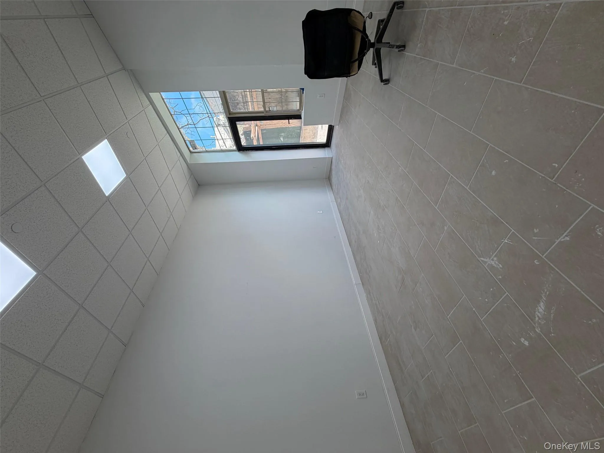 Spare room featuring a paneled ceiling Spare room featuring a paneled ceiling