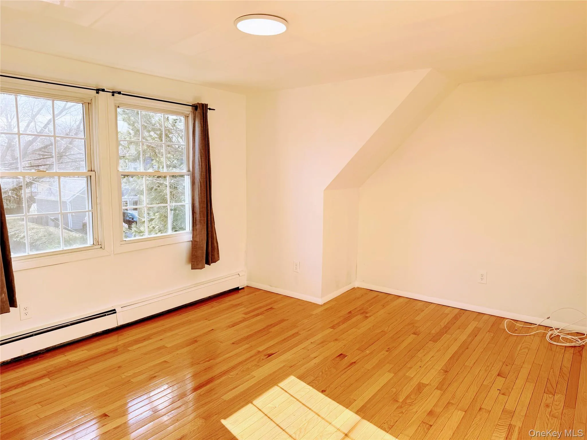 Living Room w/hardwood floors & Baseboard heat Living Room w/hardwood floors & Baseboard heat