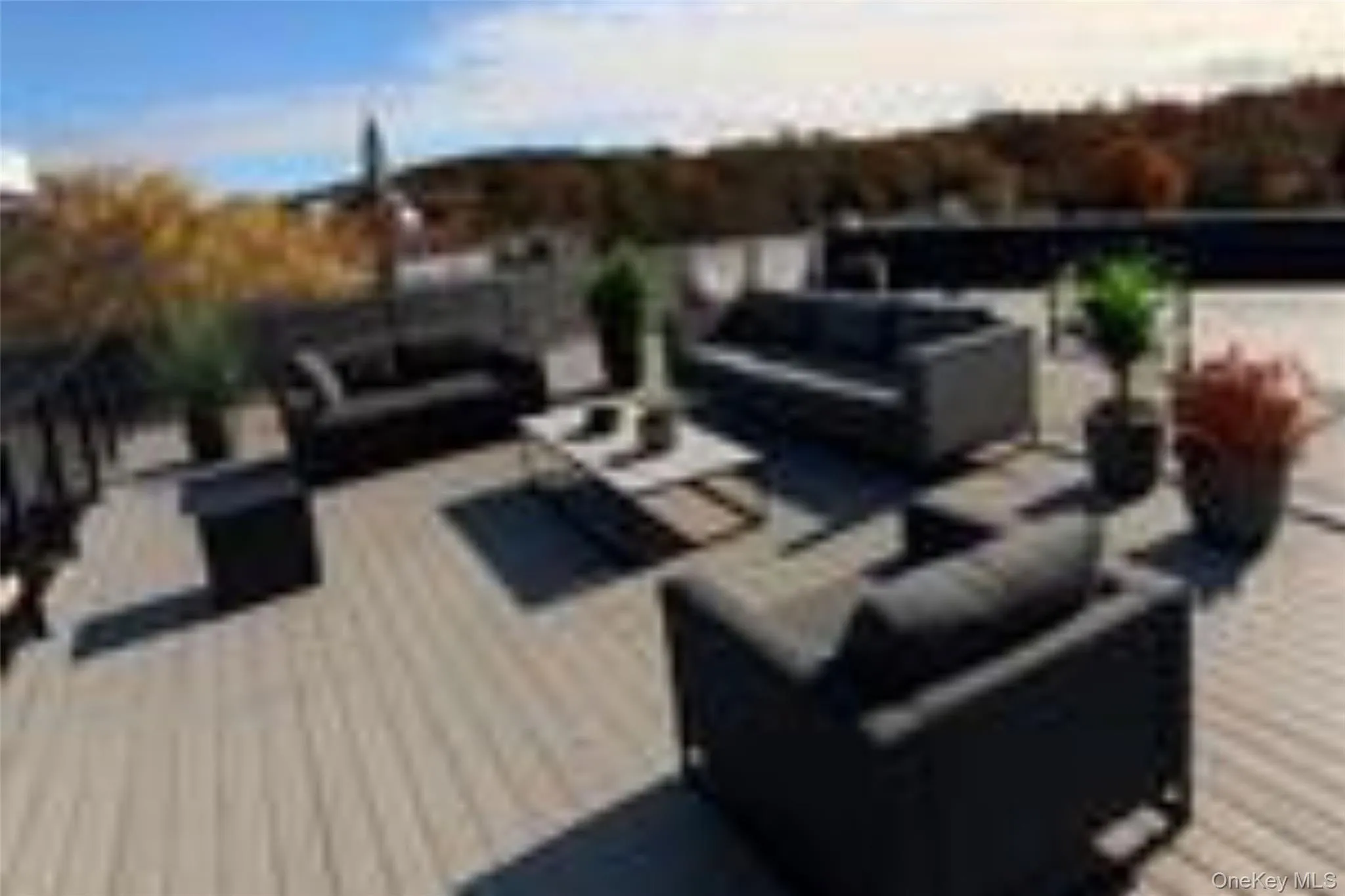 View of patio with an outdoor living space and a rooftop deck View of patio with an outdoor living space and a rooftop deck