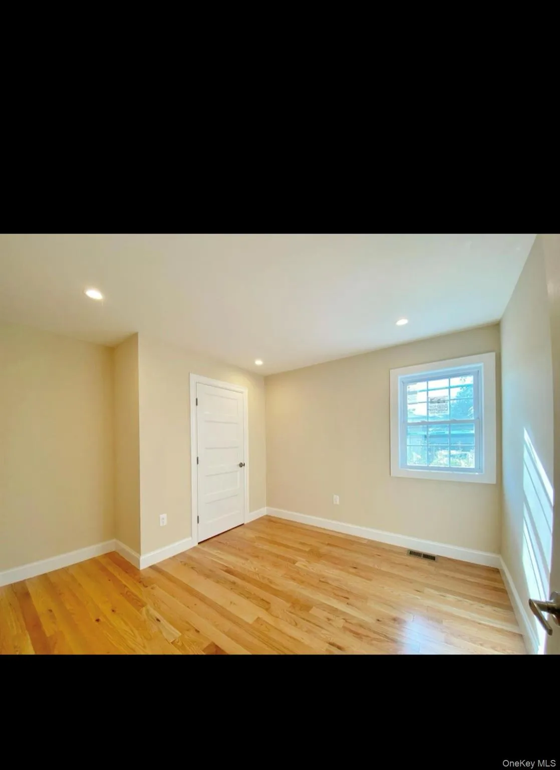 Spare room featuring light wood-type flooring and recessed lighting Spare room featuring light wood-type flooring and recessed lighting