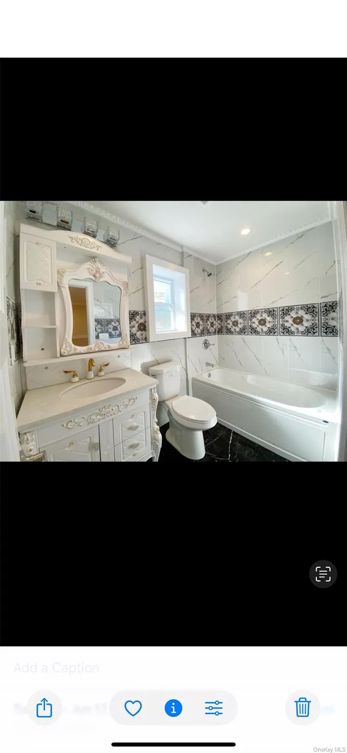 Bathroom with vanity and tile walls Bathroom with vanity and tile walls