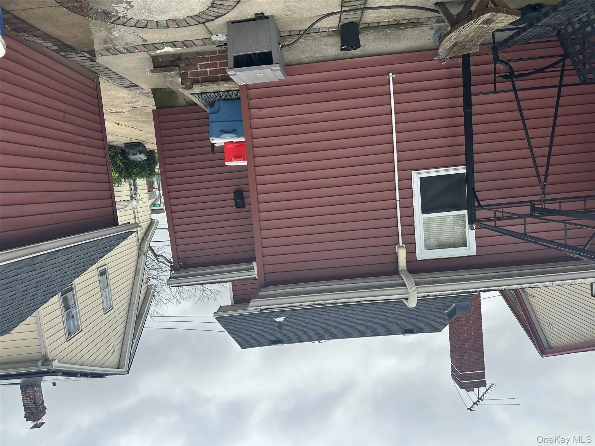 View of side of property with a shingled roof View of side of property with a shingled roof