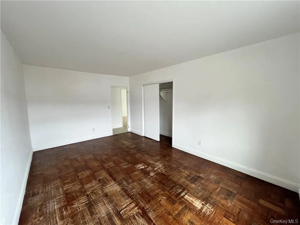 Unfurnished bedroom featuring baseboards and a closet Unfurnished bedroom featuring baseboards and a closet