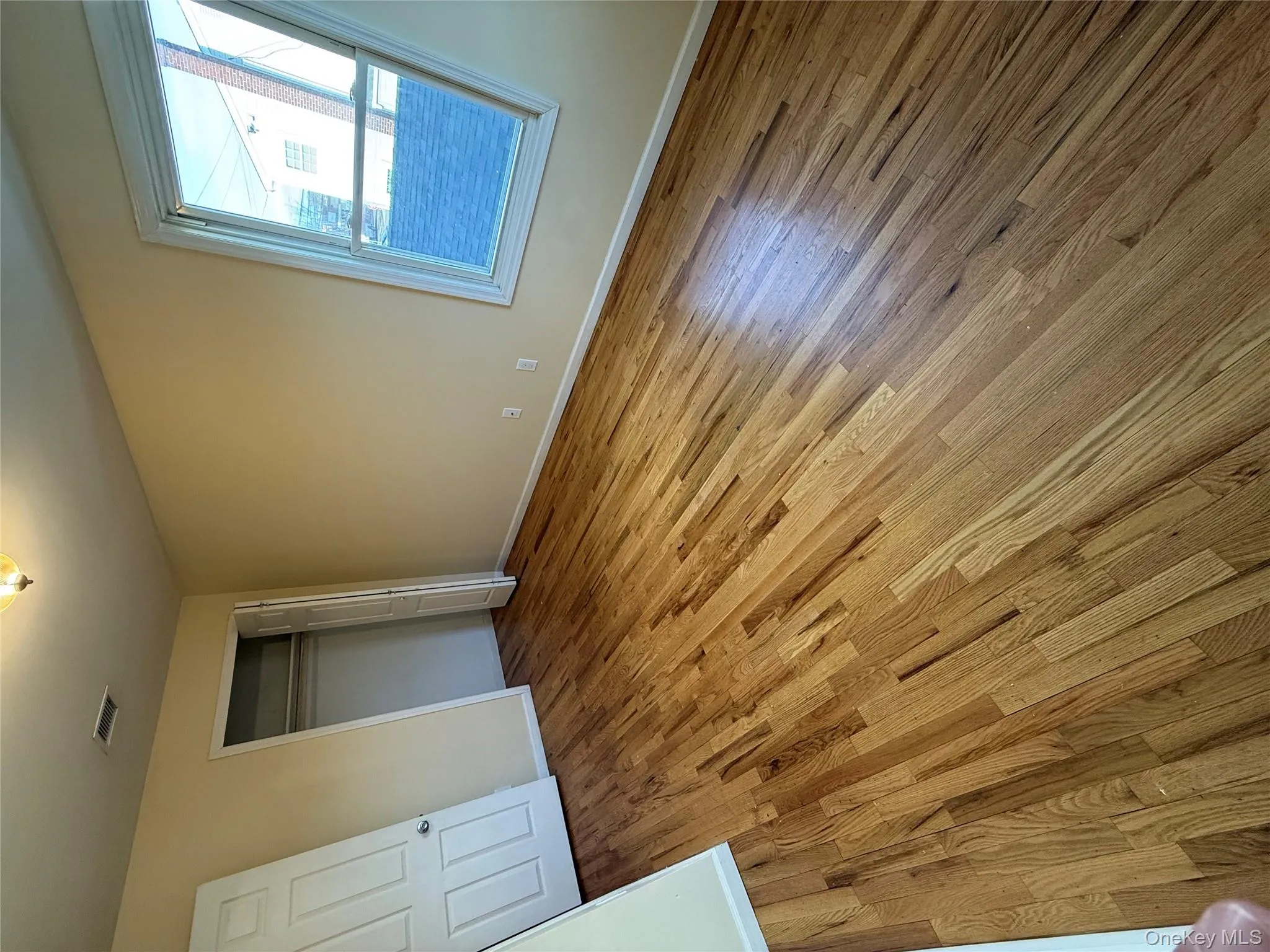 Unfurnished bedroom featuring light wood-style floors and a closet Unfurnished bedroom featuring light wood-style floors and a closet