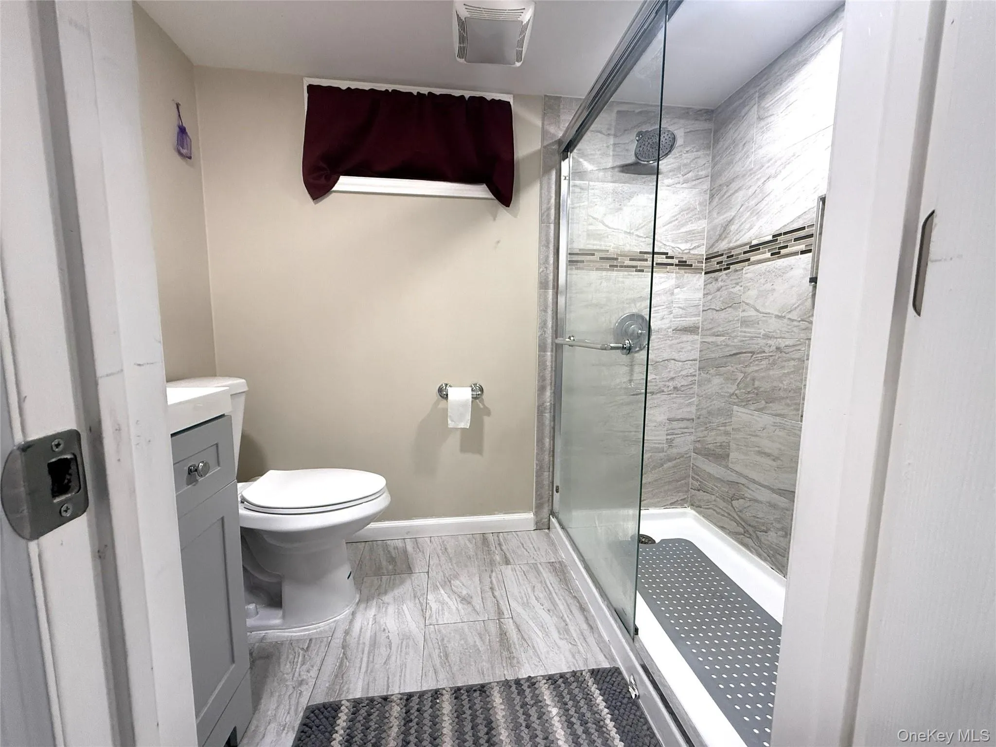 Full bath with a stall shower and vanity Full bath with a stall shower and vanity