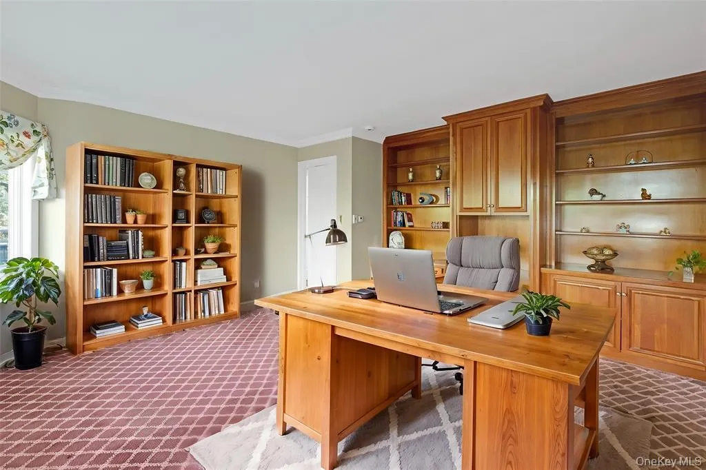 Office featuring ornamental molding and dark carpet Office featuring ornamental molding and dark carpet