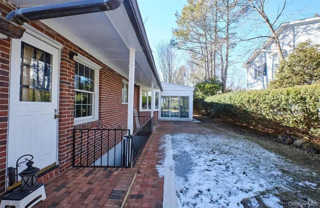 View of patio / terrace with a sunroom View of patio / terrace with a sunroom