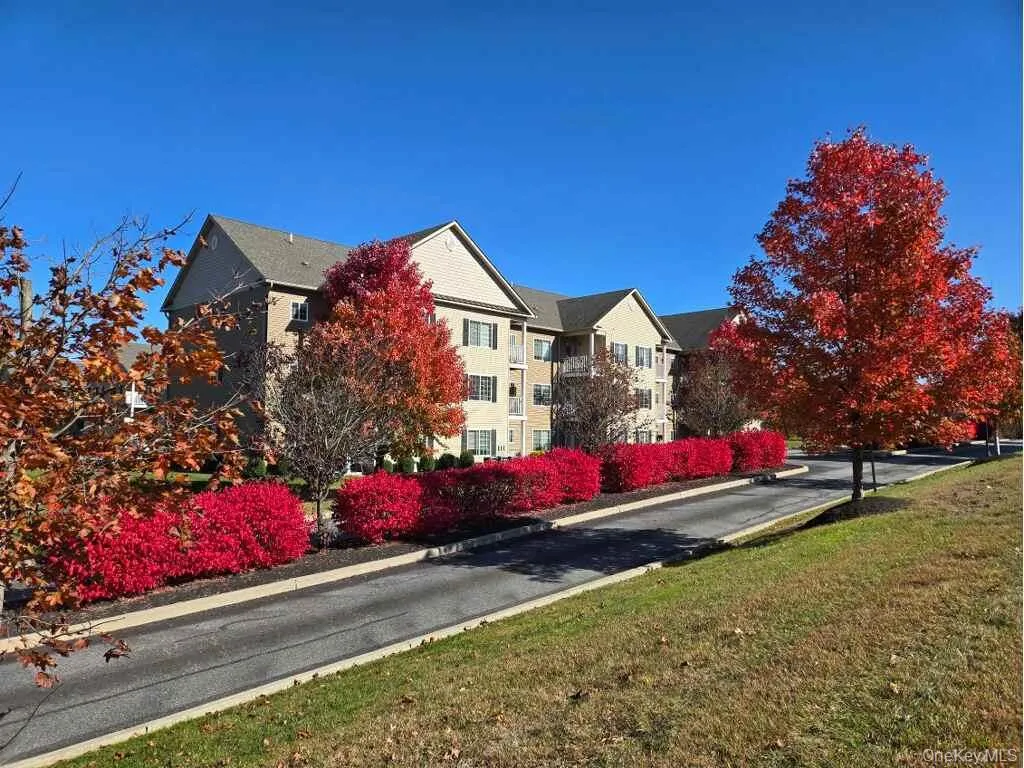 View of property exterior featuring a yard View of property exterior featuring a yard
