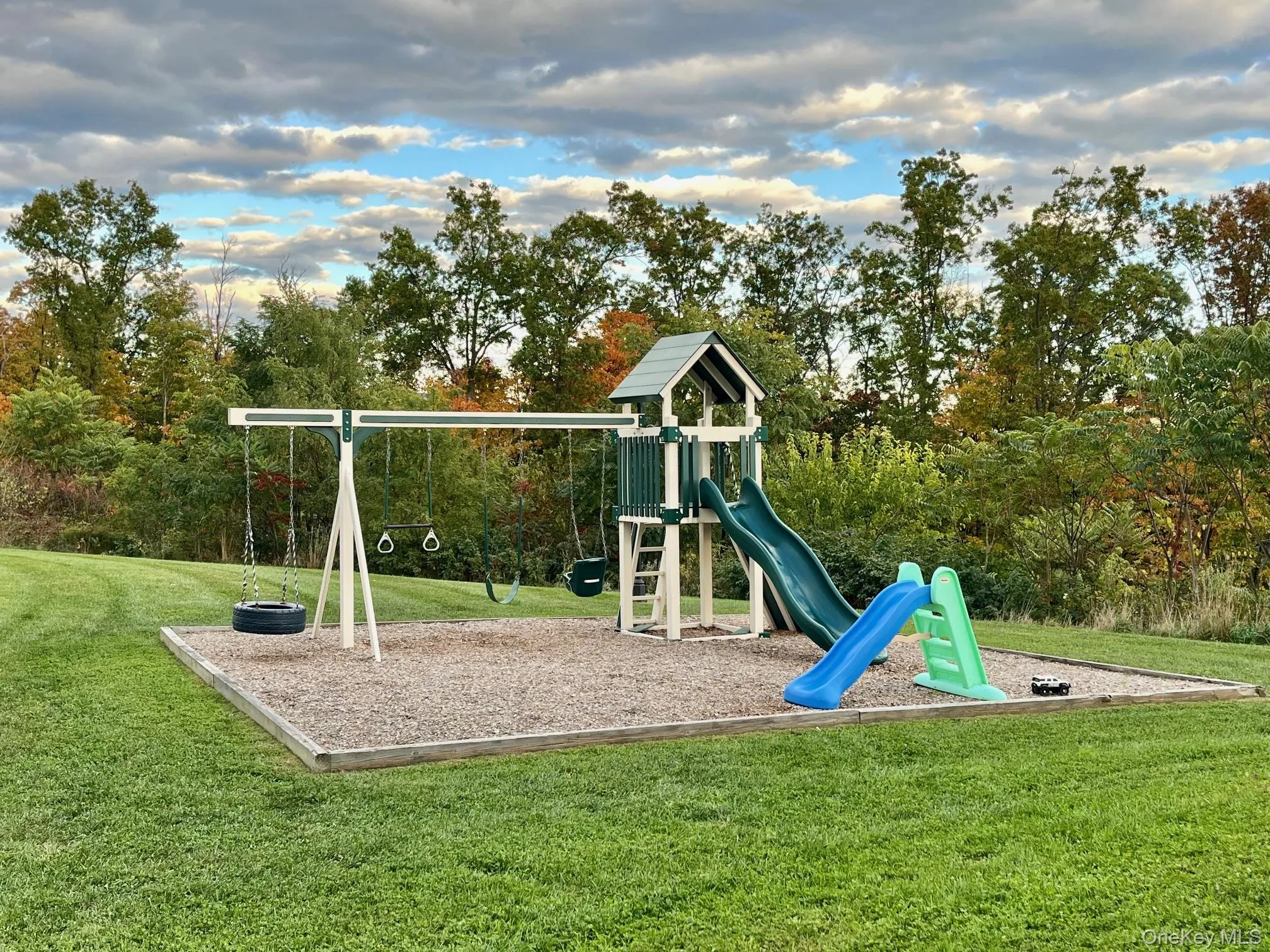View of jungle gym featuring a lawn View of jungle gym featuring a lawn