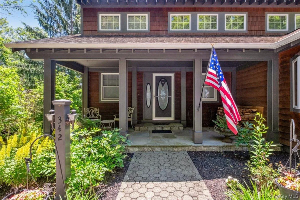 View of exterior entry featuring roof with shingles View of exterior entry featuring roof with shingles