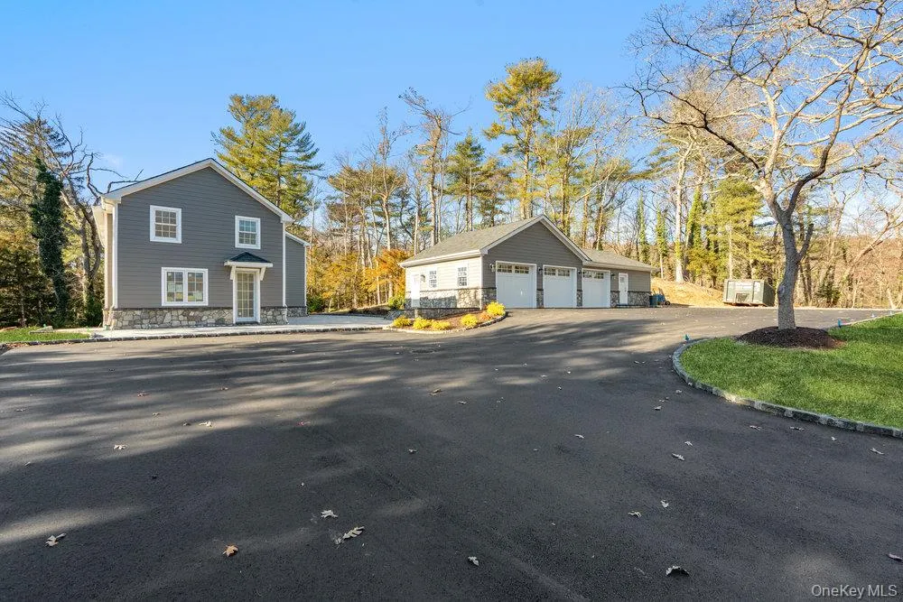 View of side of property with an outbuilding and a garage View of side of property with an outbuilding and a garage