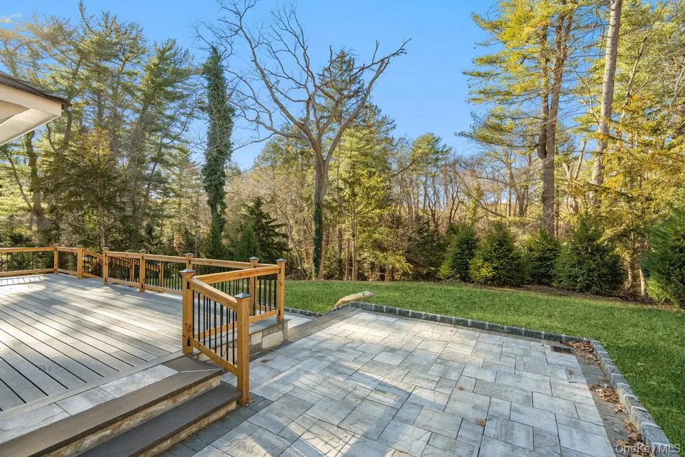 Deck featuring a yard and a patio Deck featuring a yard and a patio