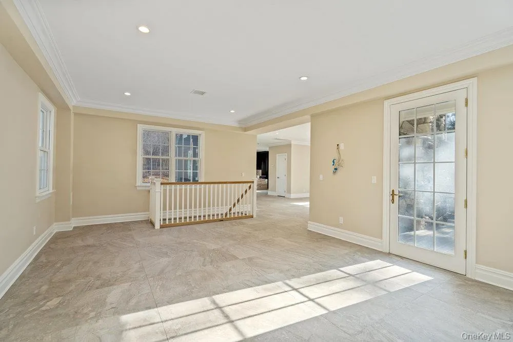 Spare room featuring crown molding and recessed lighting Spare room featuring crown molding and recessed lighting