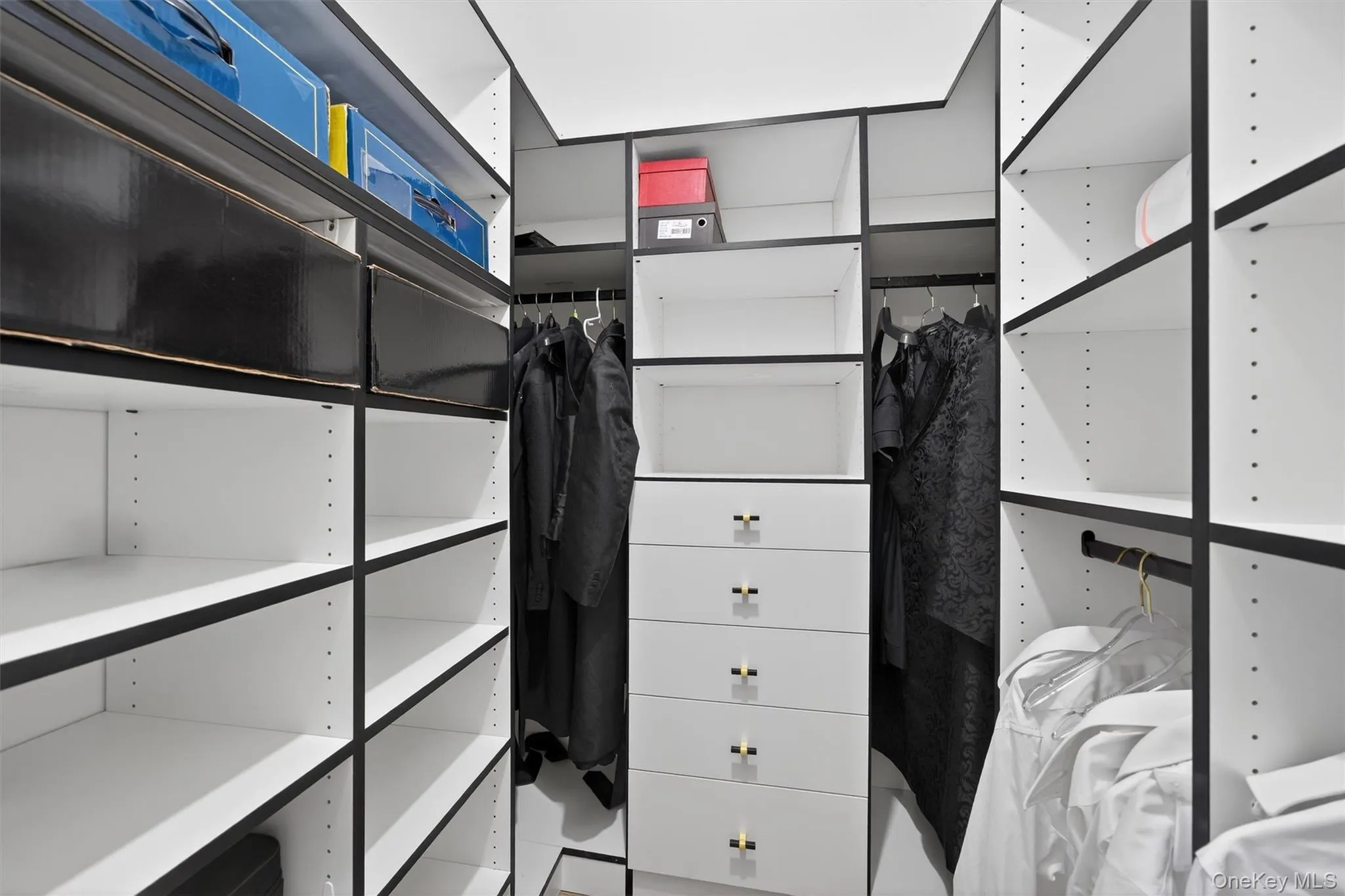 View of the master bedroom's spacious closet View of the master bedroom's spacious closet