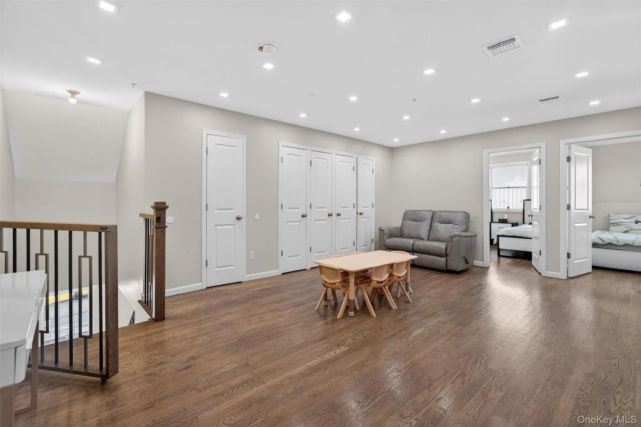 Playroom area featuring dark wood finished floors and recessed lighting Playroom area featuring dark wood finished floors and recessed lighting