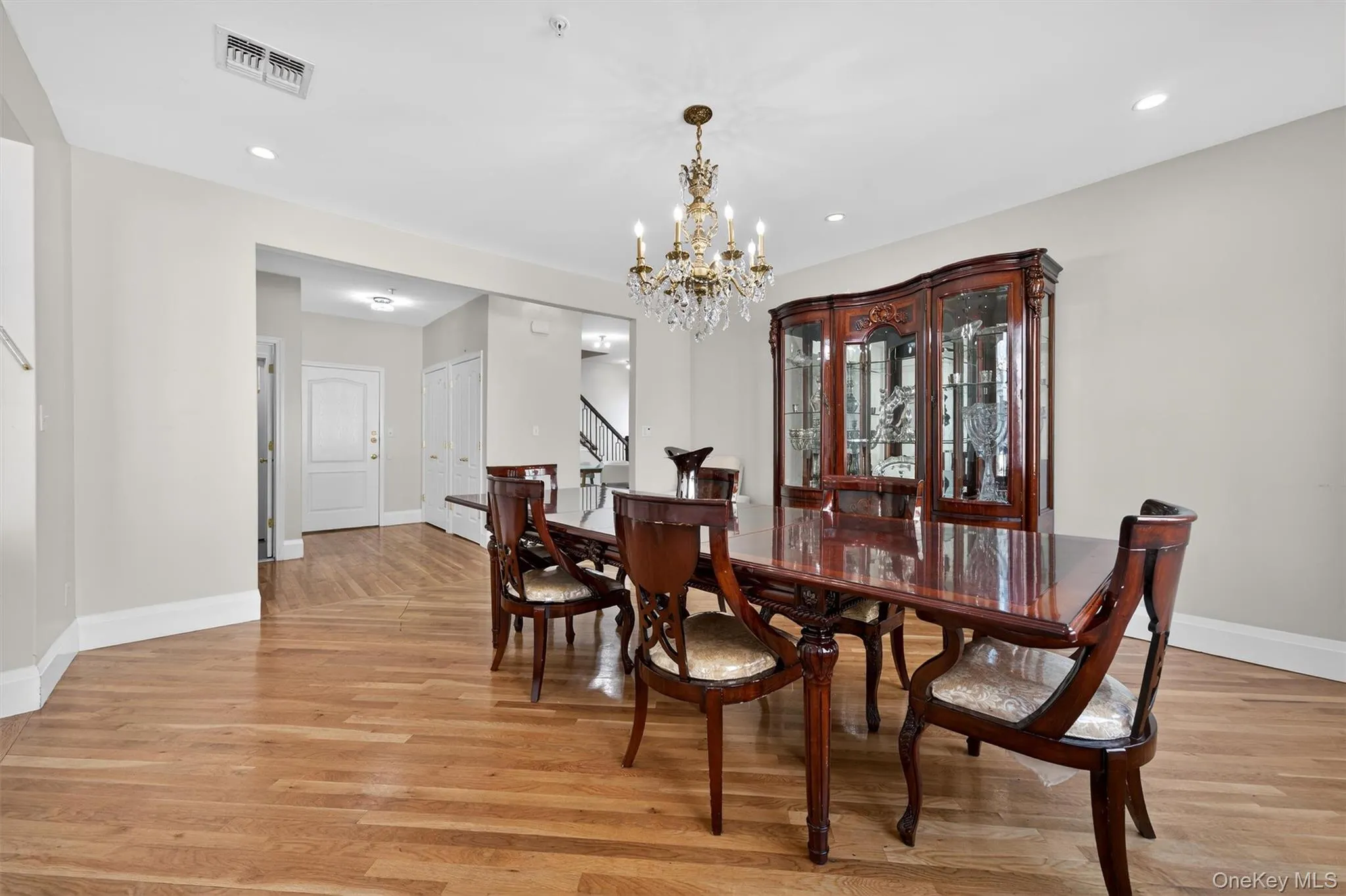 Dining area featuring light wood finished floors, a chandelier, and recessed lighting Dining area featuring light wood finished floors, a chandelier, and recessed lighting