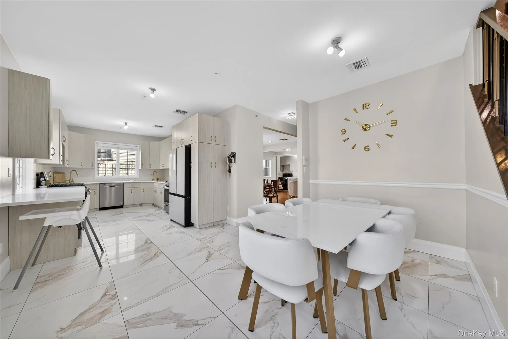 Dining space featuring light marble finish flooring Dining space featuring light marble finish flooring