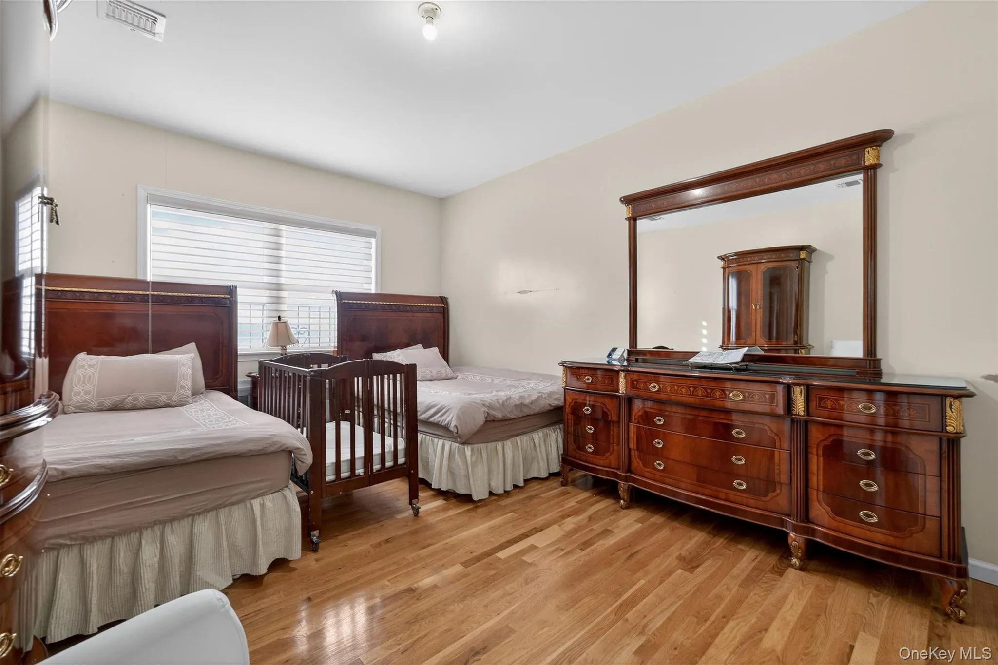 Bedroom featuring light wood-style flooring Bedroom featuring light wood-style flooring