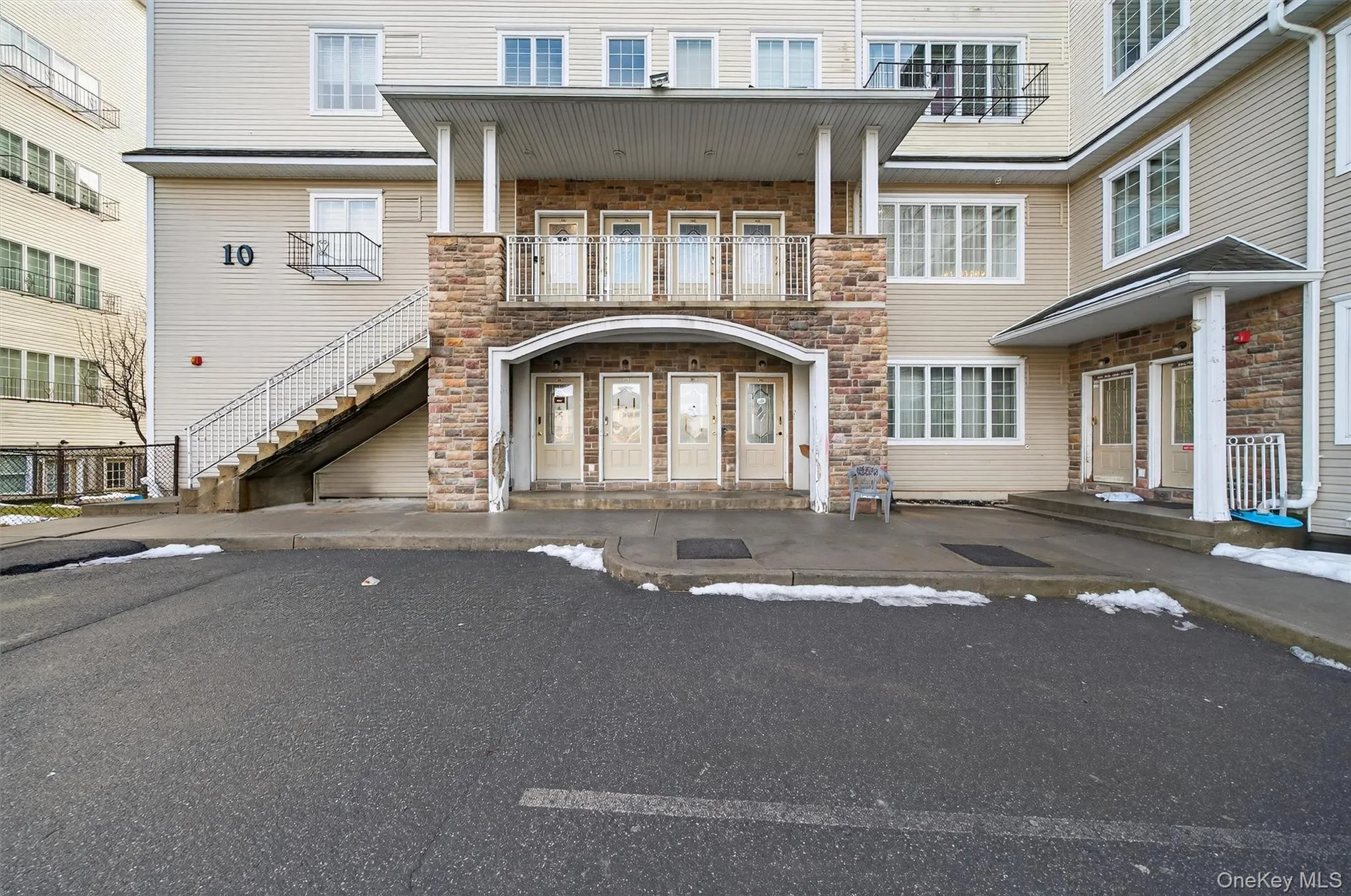 Entrance to property featuring stone siding Entrance to property featuring stone siding