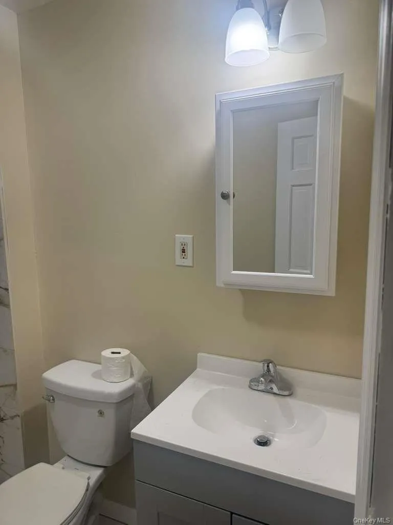 Full bath with vanity and a shower Full bath with vanity and a shower