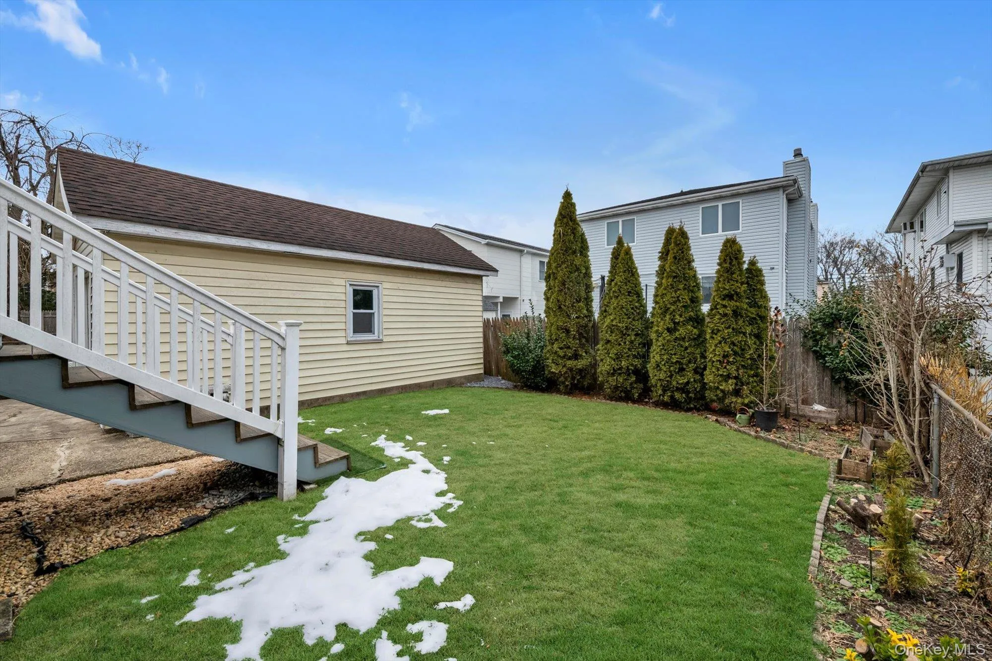 Fenced backyard with stairway Fenced backyard with stairway