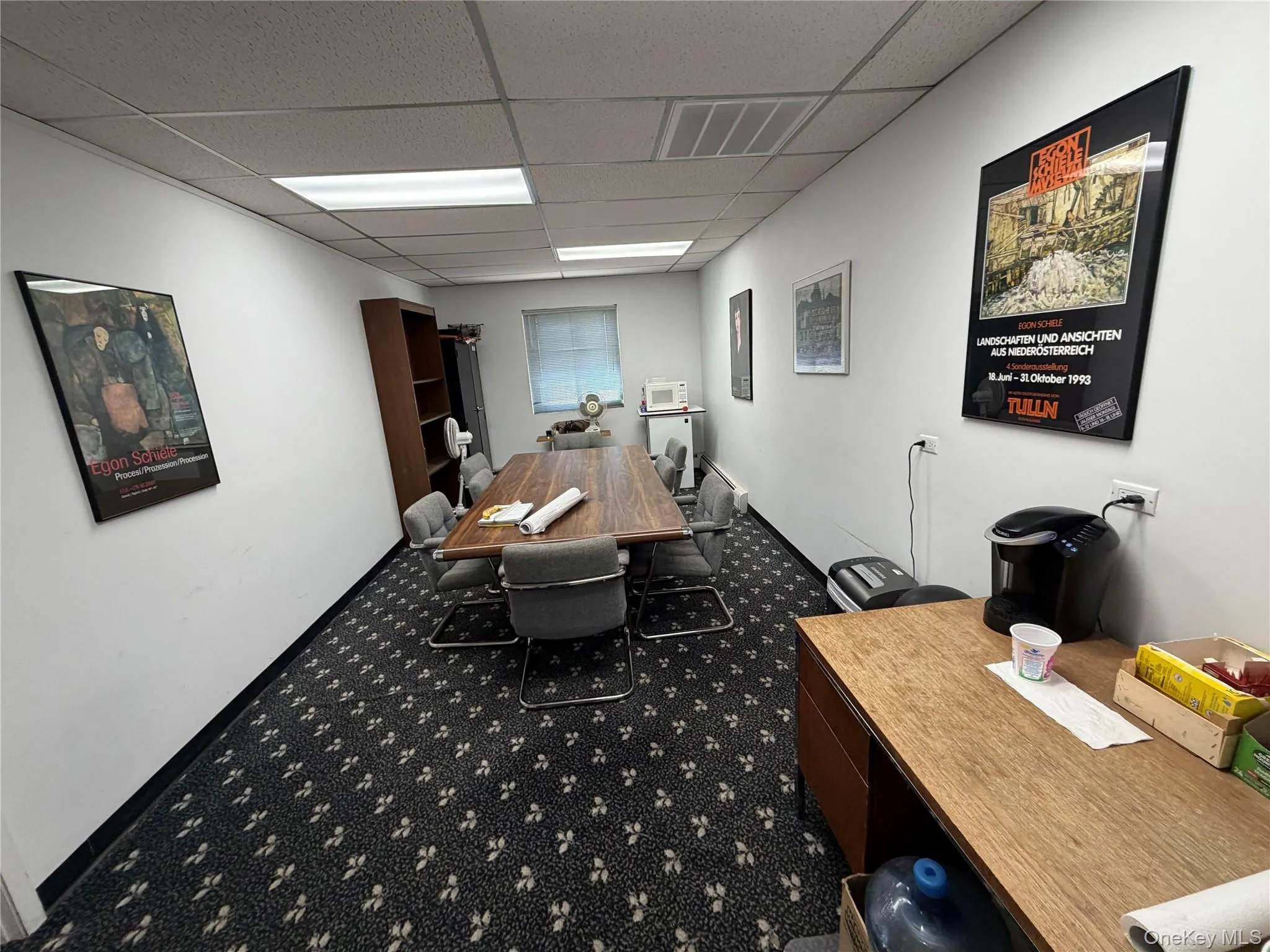 Home office with a paneled ceiling Home office with a paneled ceiling