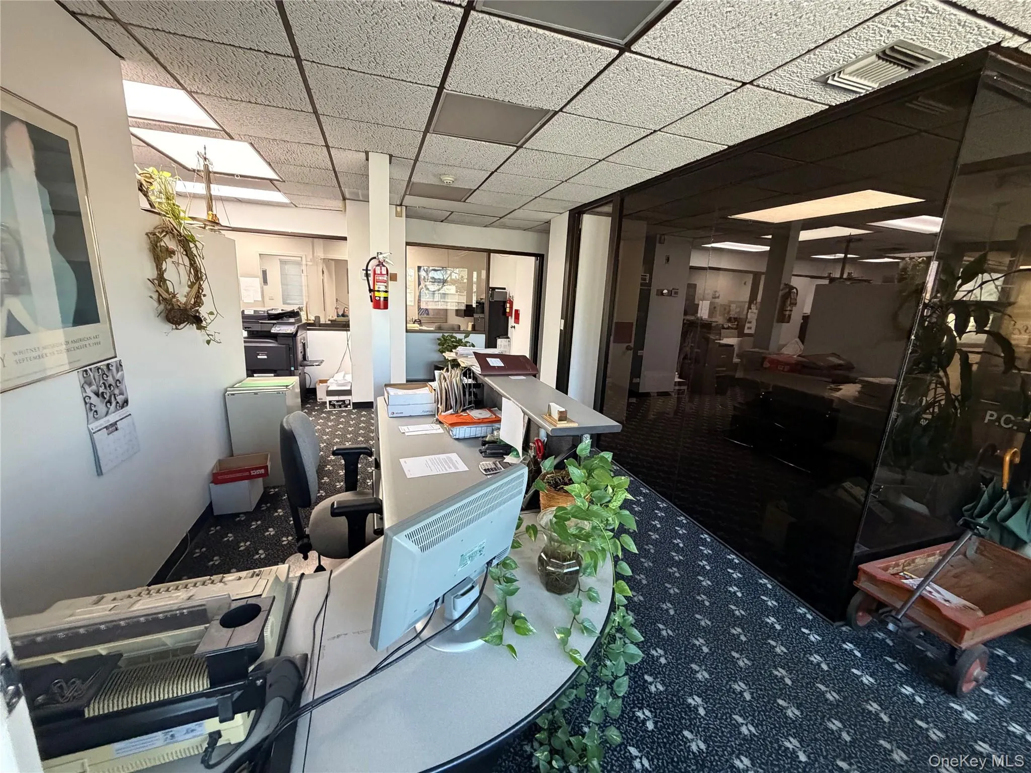 Office with a paneled ceiling Office with a paneled ceiling