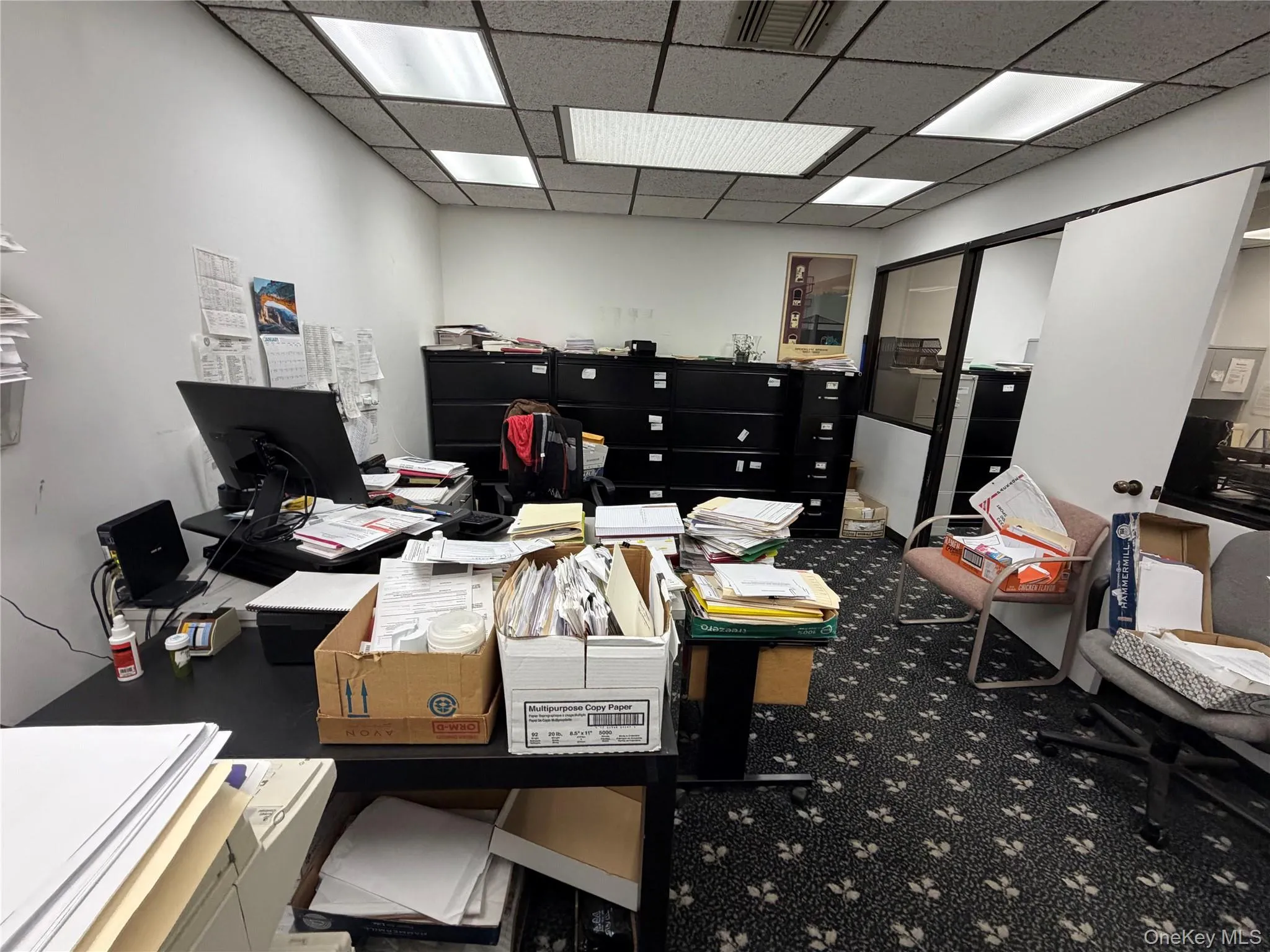Office space with a drop ceiling Office space with a drop ceiling