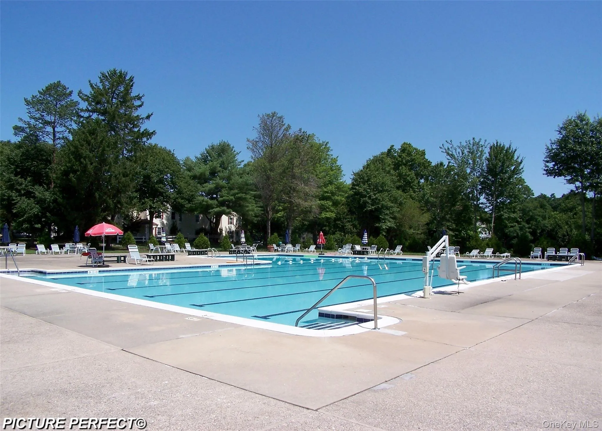 Community pool featuring a patio area Community pool featuring a patio area