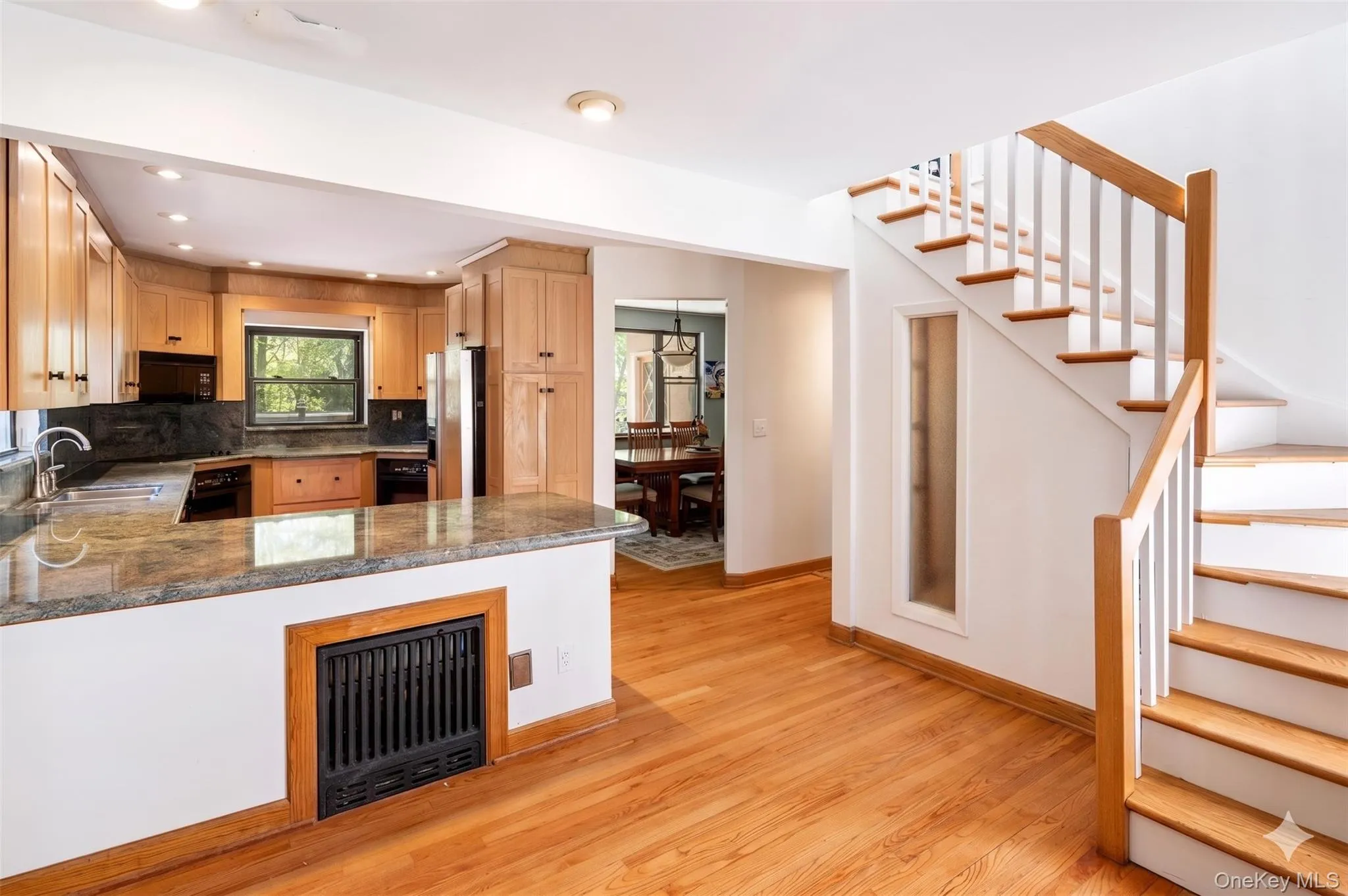 Kitchen with Entry to Dining Room and Stairs to Primary Bedroom Kitchen with Entry to Dining Room and Stairs to Primary Bedroom